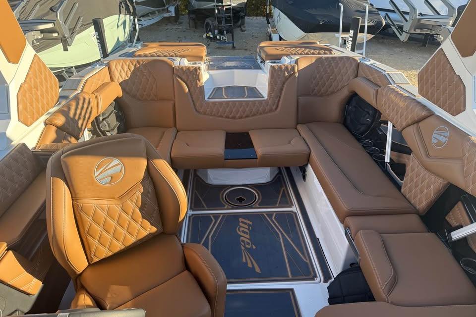 Luxurious interior of 2026 Tigé 22RZX boat with tan leather seating.