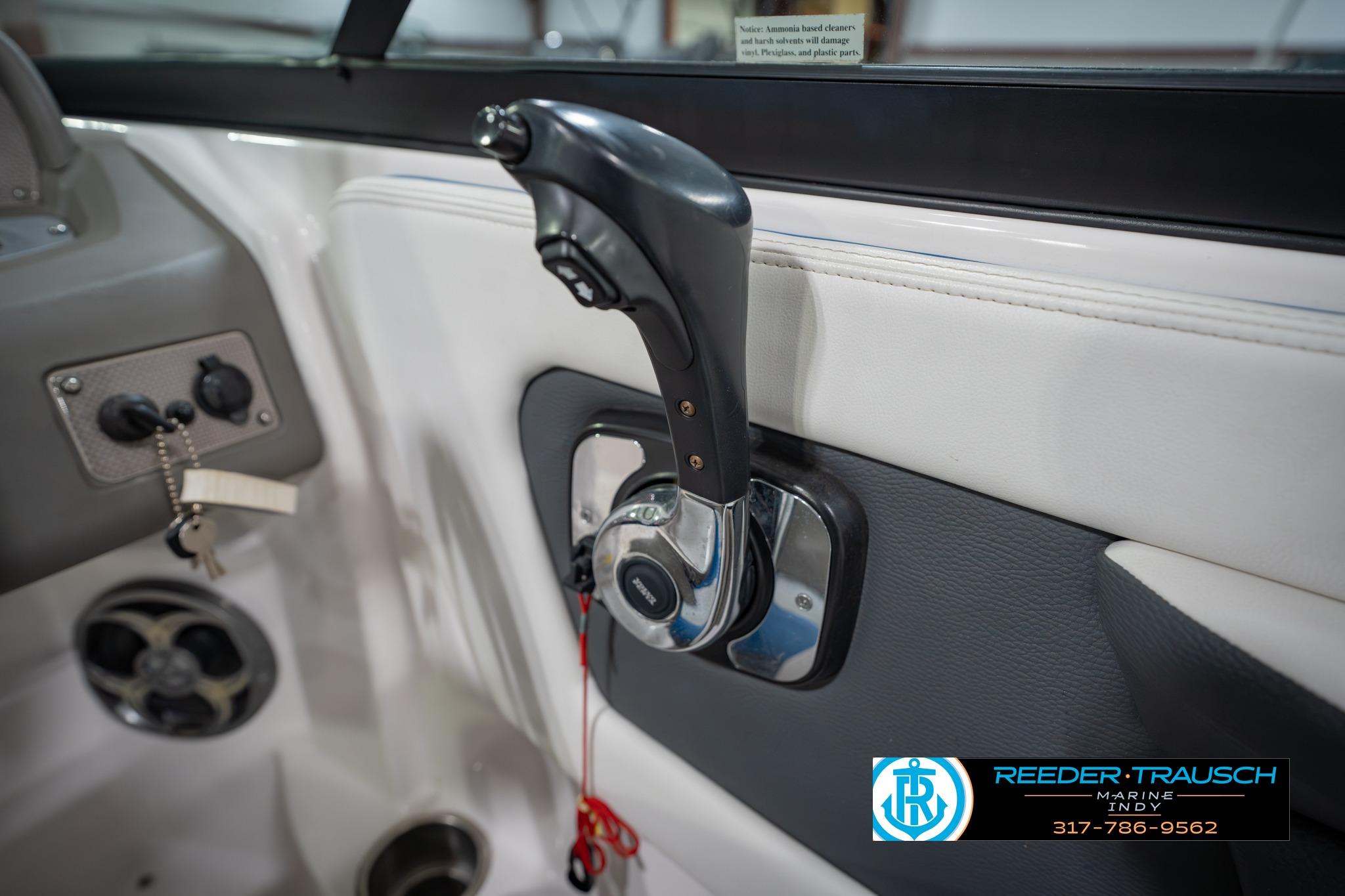 Close-up of 2015 Regal 2000 ESX Bowrider throttle control in boat cockpit.