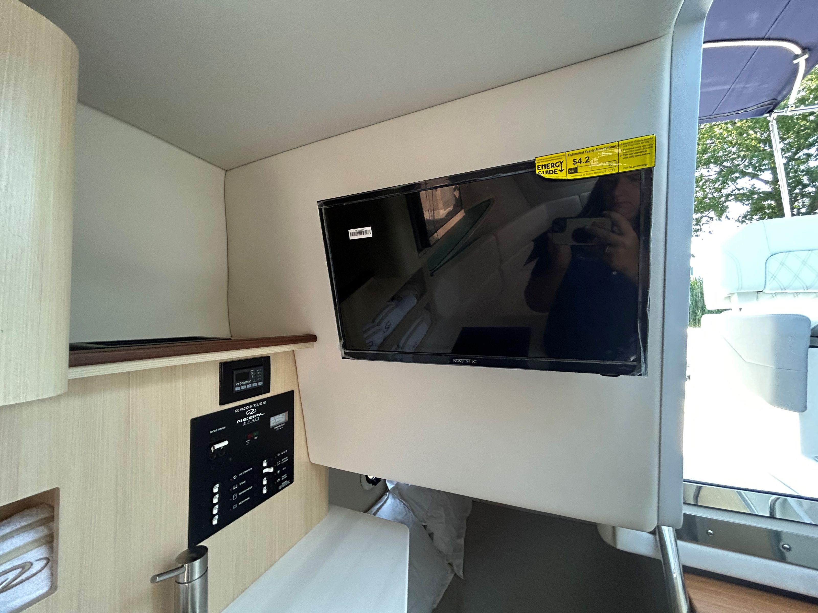 2025 Regal 26 XO interior with mounted TV and control panel.