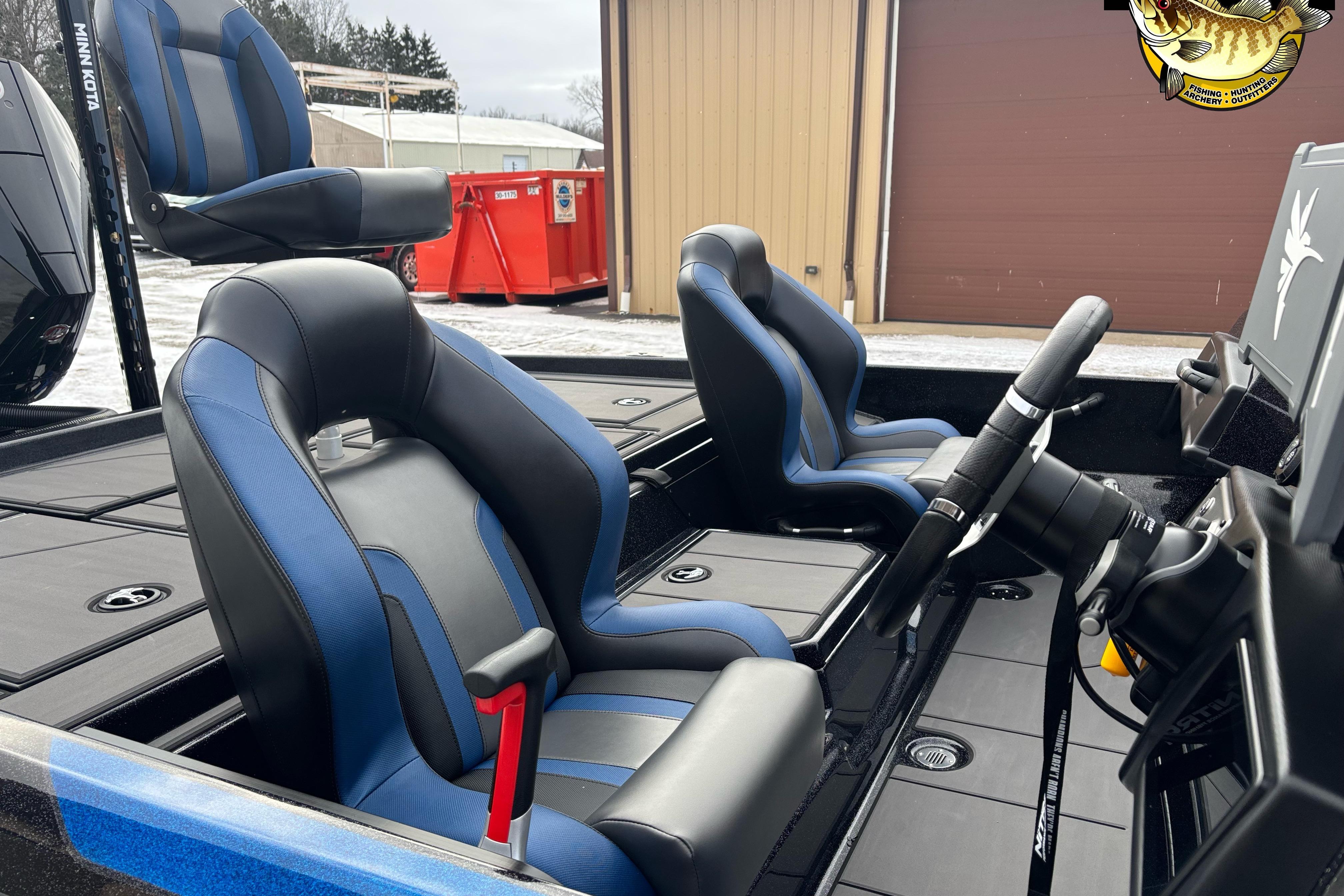 2026 Nitro Z21 XL boat interior with blue and black seats, steering wheel, and controls.