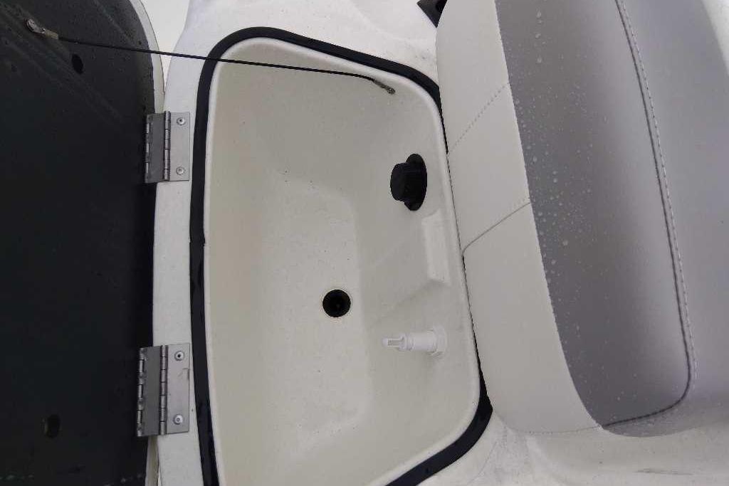 2026 Mako Pro Skiff 17 CC storage compartment with cushioned seat.