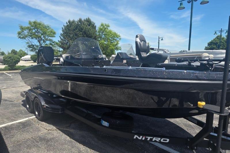 2026 Nitro ZV21 boat on trailer in parking lot, sunny day.