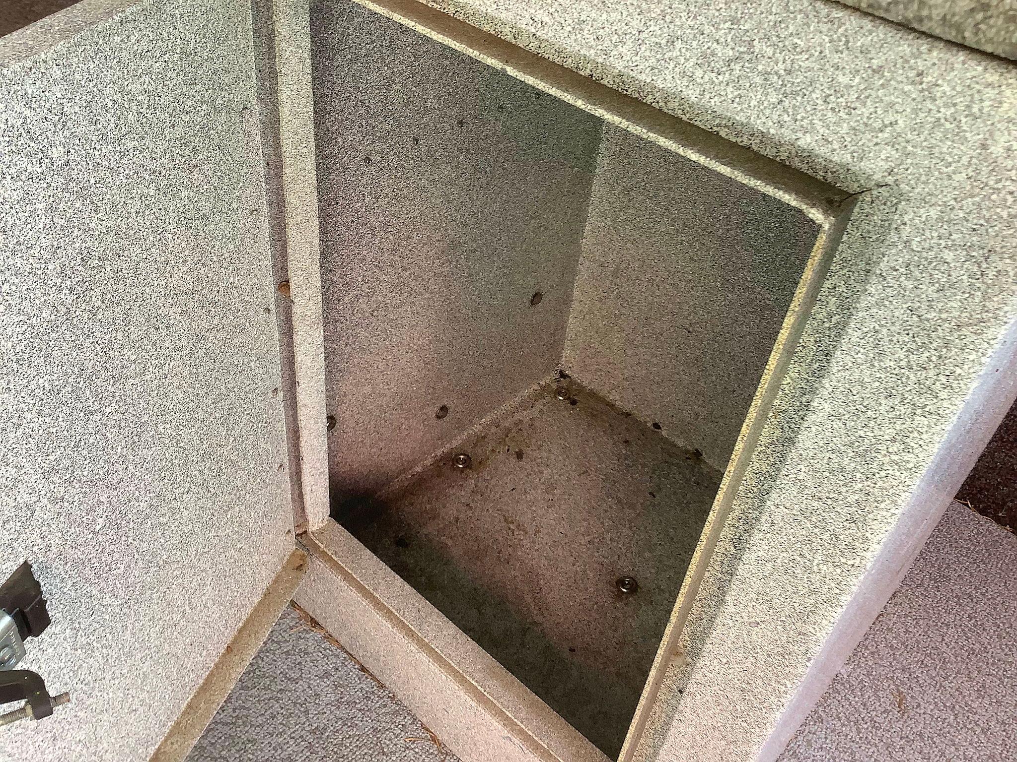 Open storage compartment in a 1997 Fish Rite 213 FC boat.