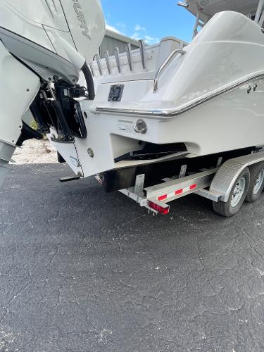 2014 Everglades 325 Center Console boat on trailer, rear view.