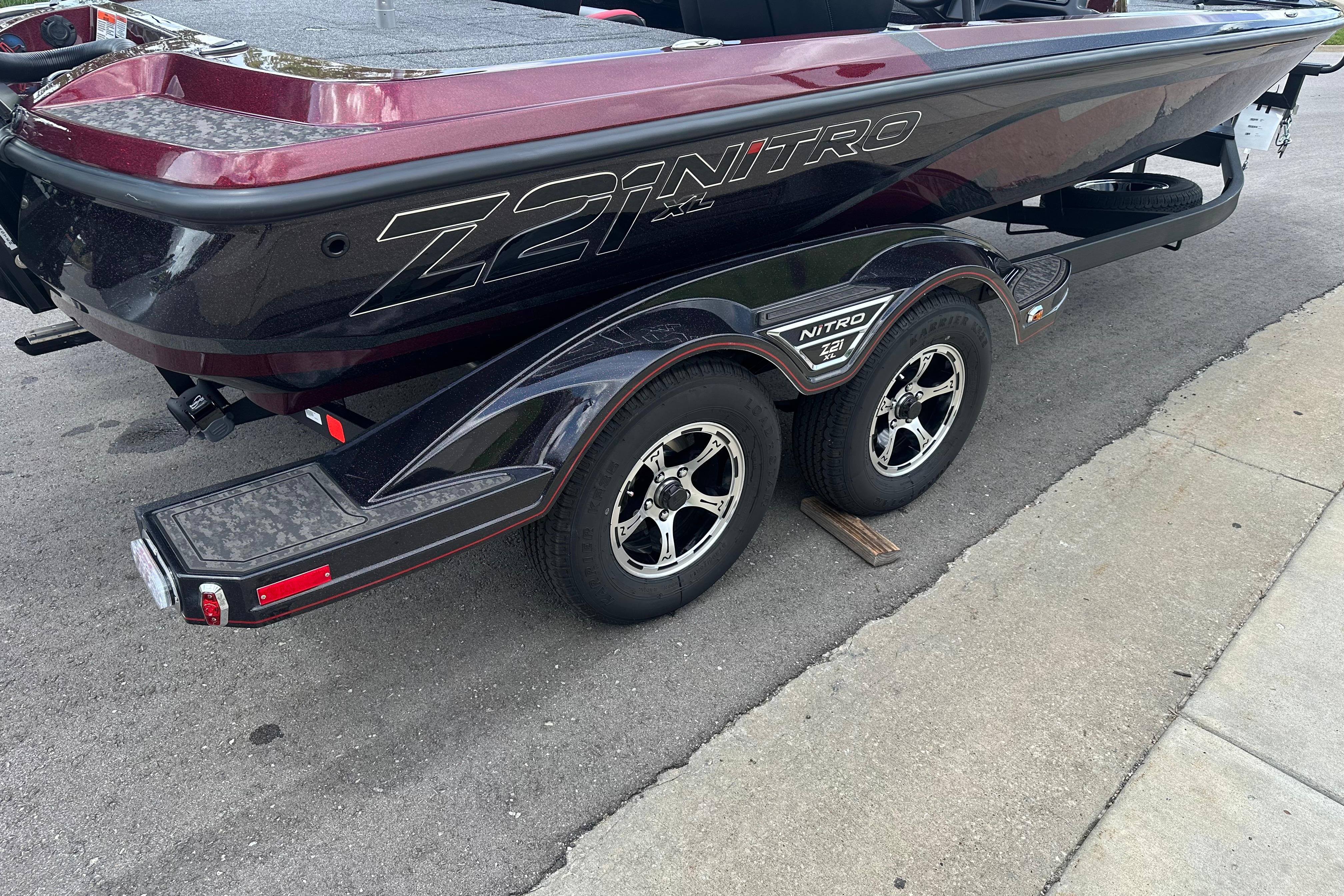 2026 Nitro Z21 XL boat on trailer, showcasing sleek design and dual wheels.
