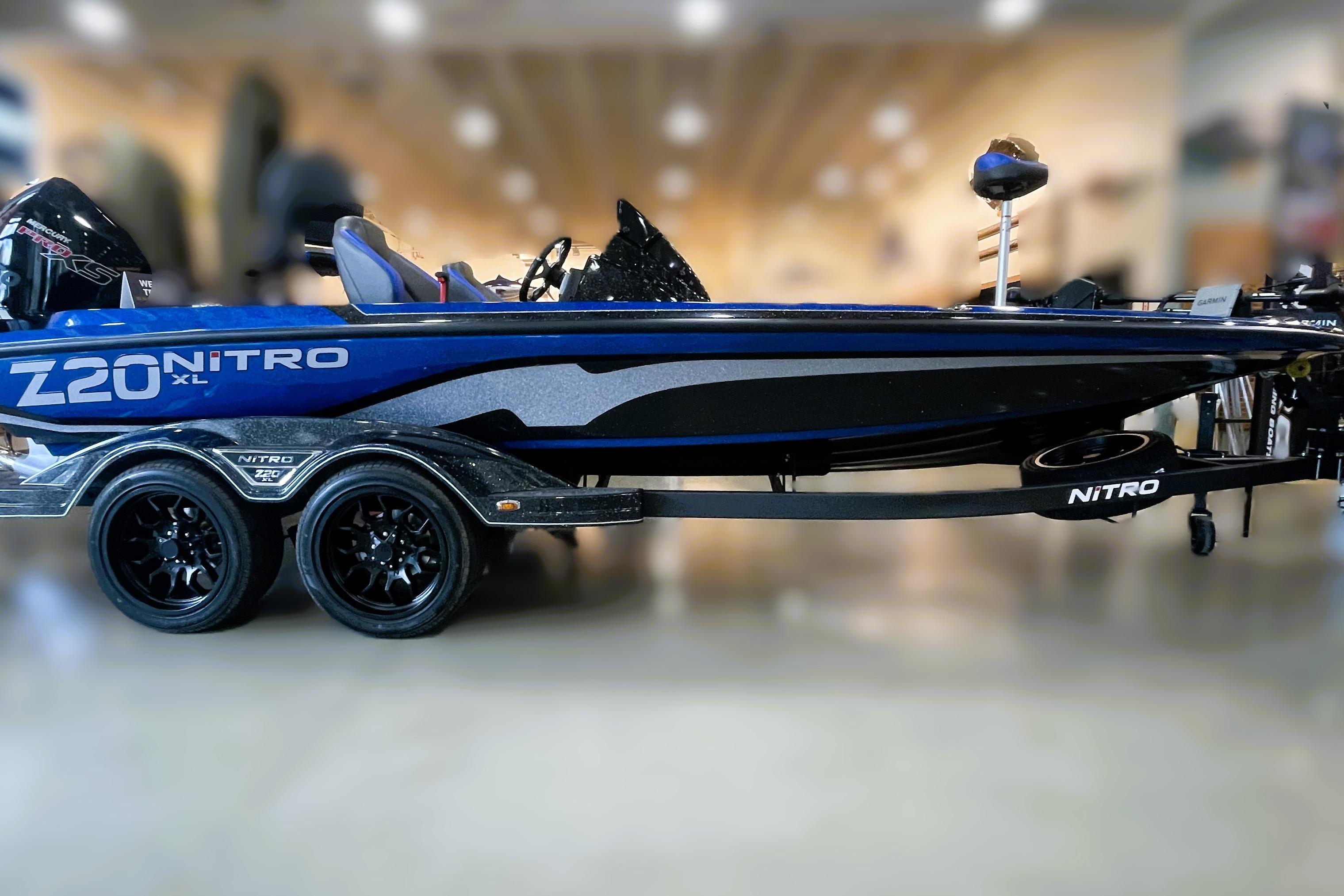2026 Nitro Z20 XL Pro boat, sleek design, dual axle trailer, showroom display.