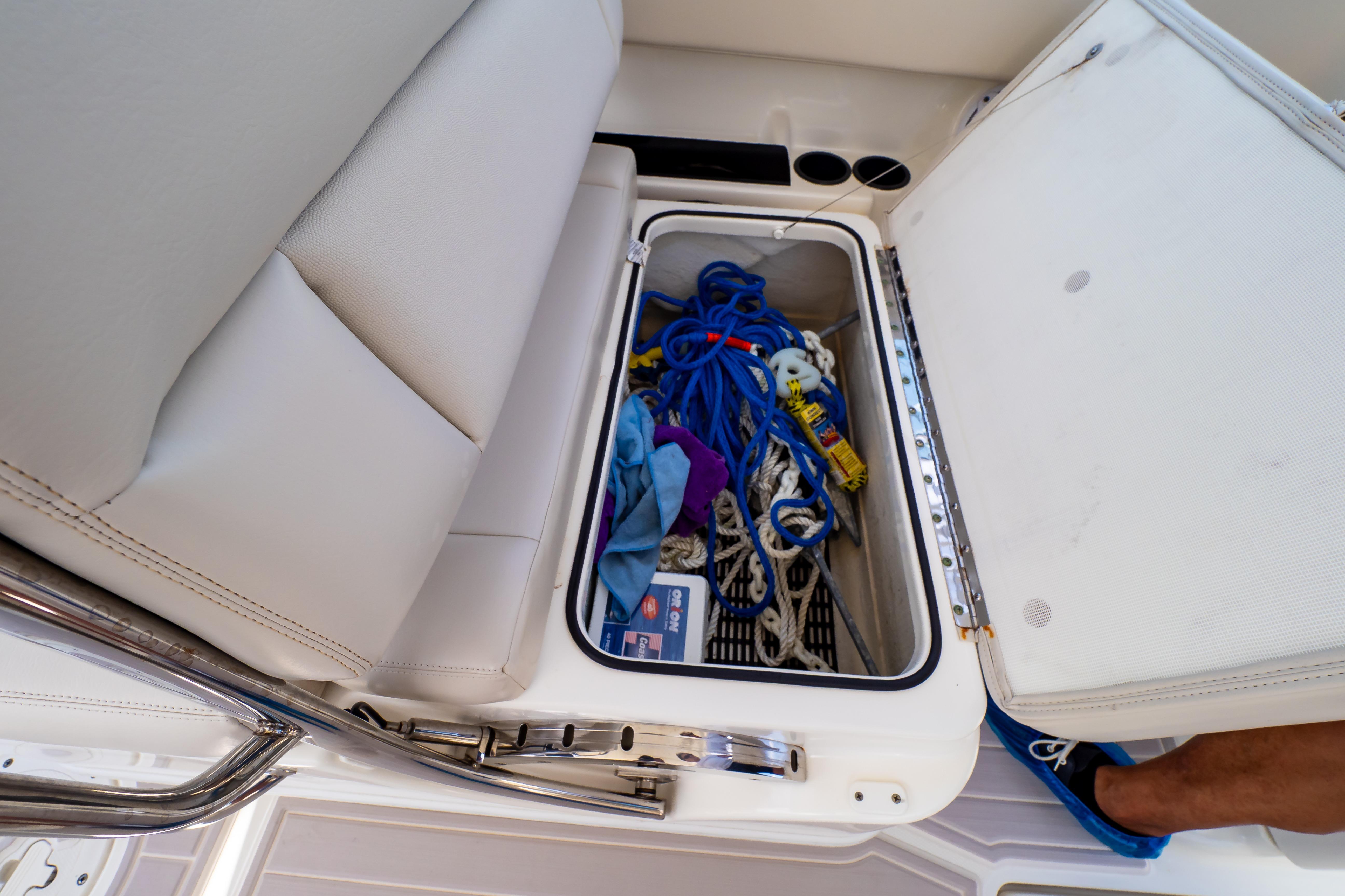 2019 Boston Whaler 270 Vantage storage compartment with ropes and accessories.
