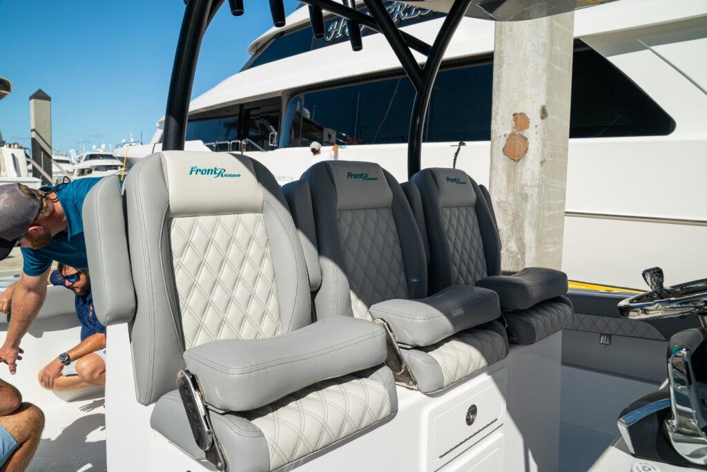 Luxury seating on 2026 Front Runner 37 Catamaran, featuring diamond-stitched upholstery and sleek design.