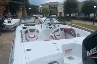 2025 Tahoe 200 S boat with sleek design and modern interior, docked outdoors.