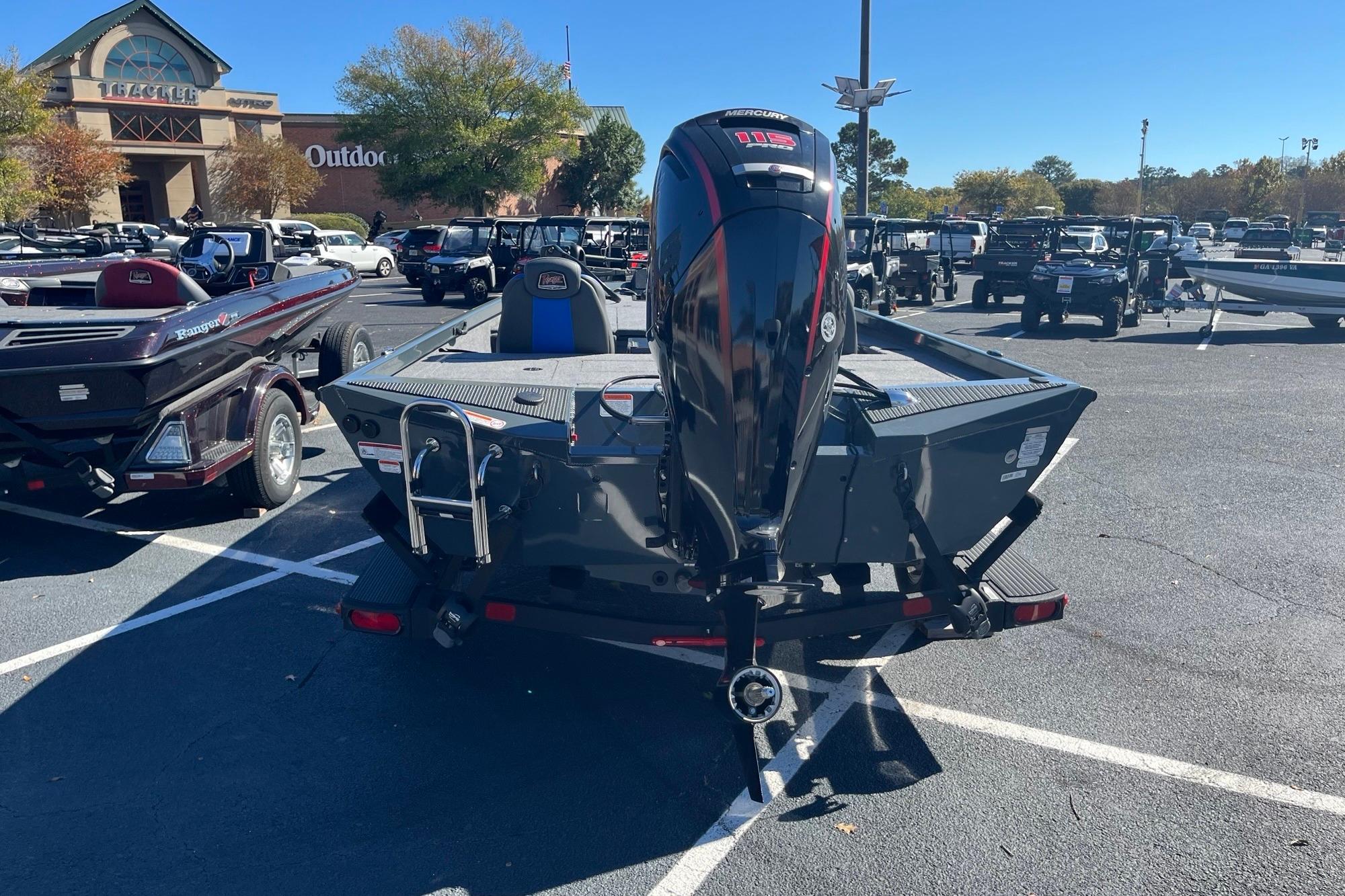2025 Ranger RT188P boat with Mercury engine in outdoor parking lot.
