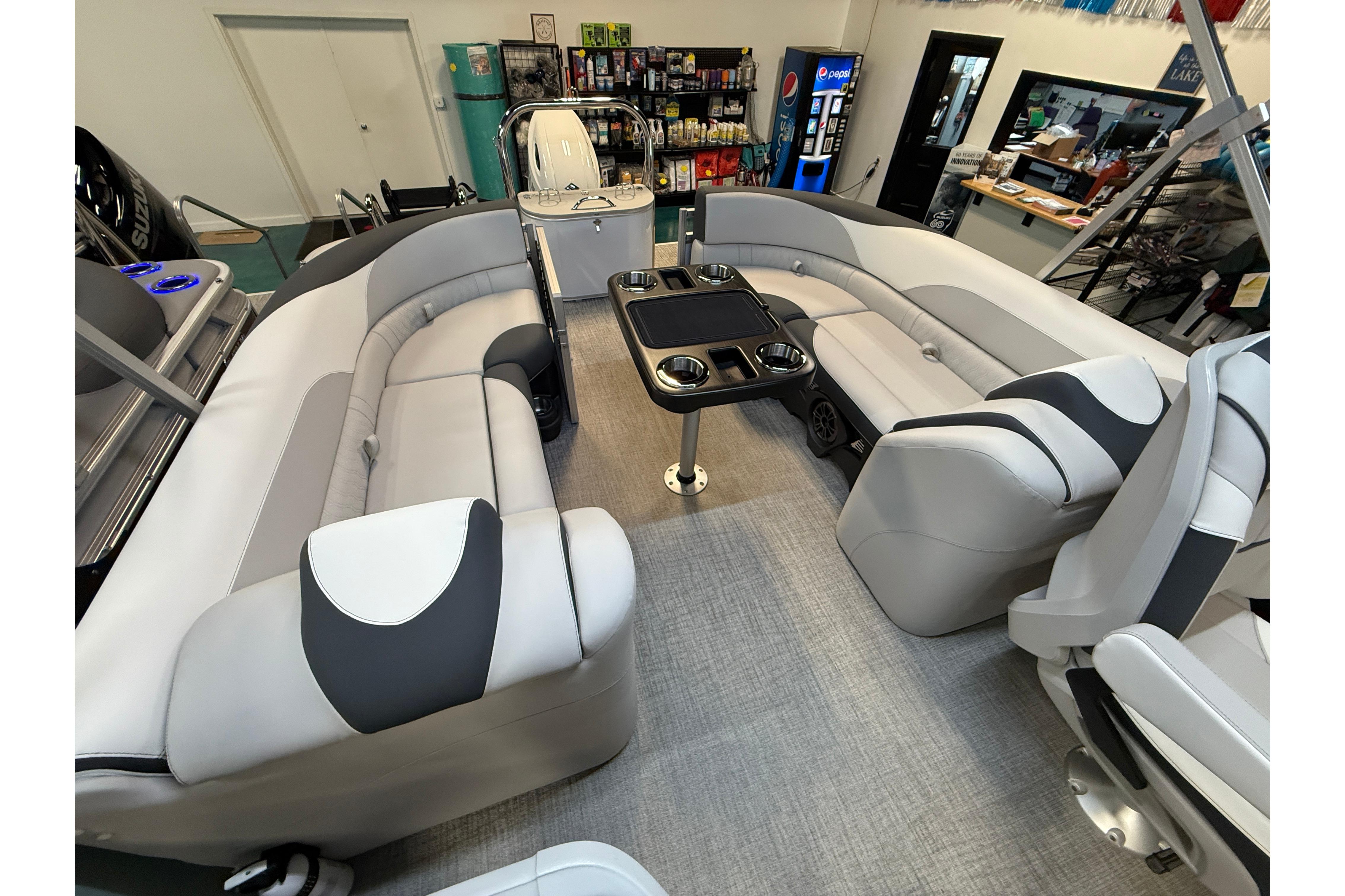 2026 Tahoe Pontoon LTZ Quad Lounger interior with plush seating and central table.