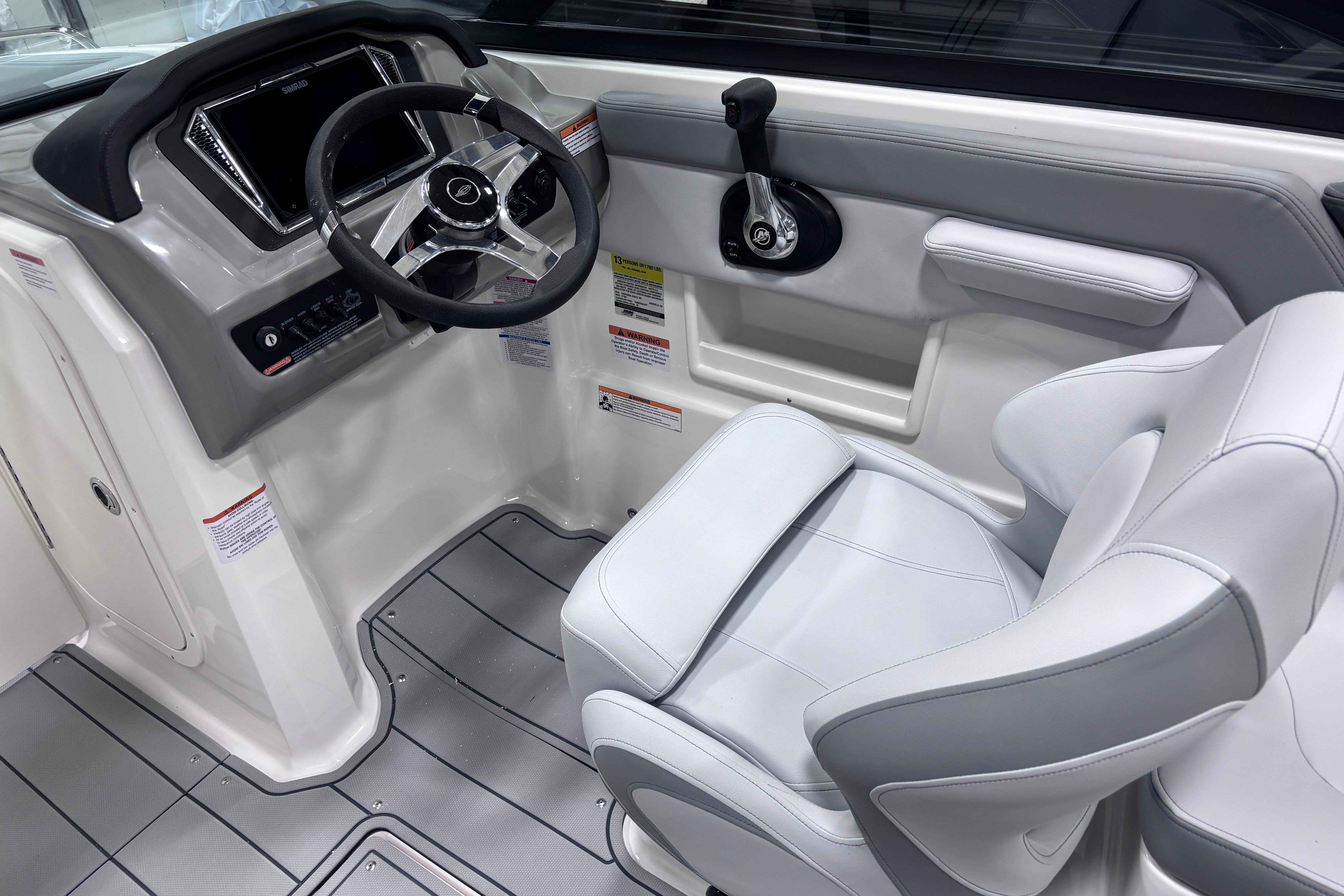 2026 Chaparral 23 SSi boat interior with modern steering and seating design.