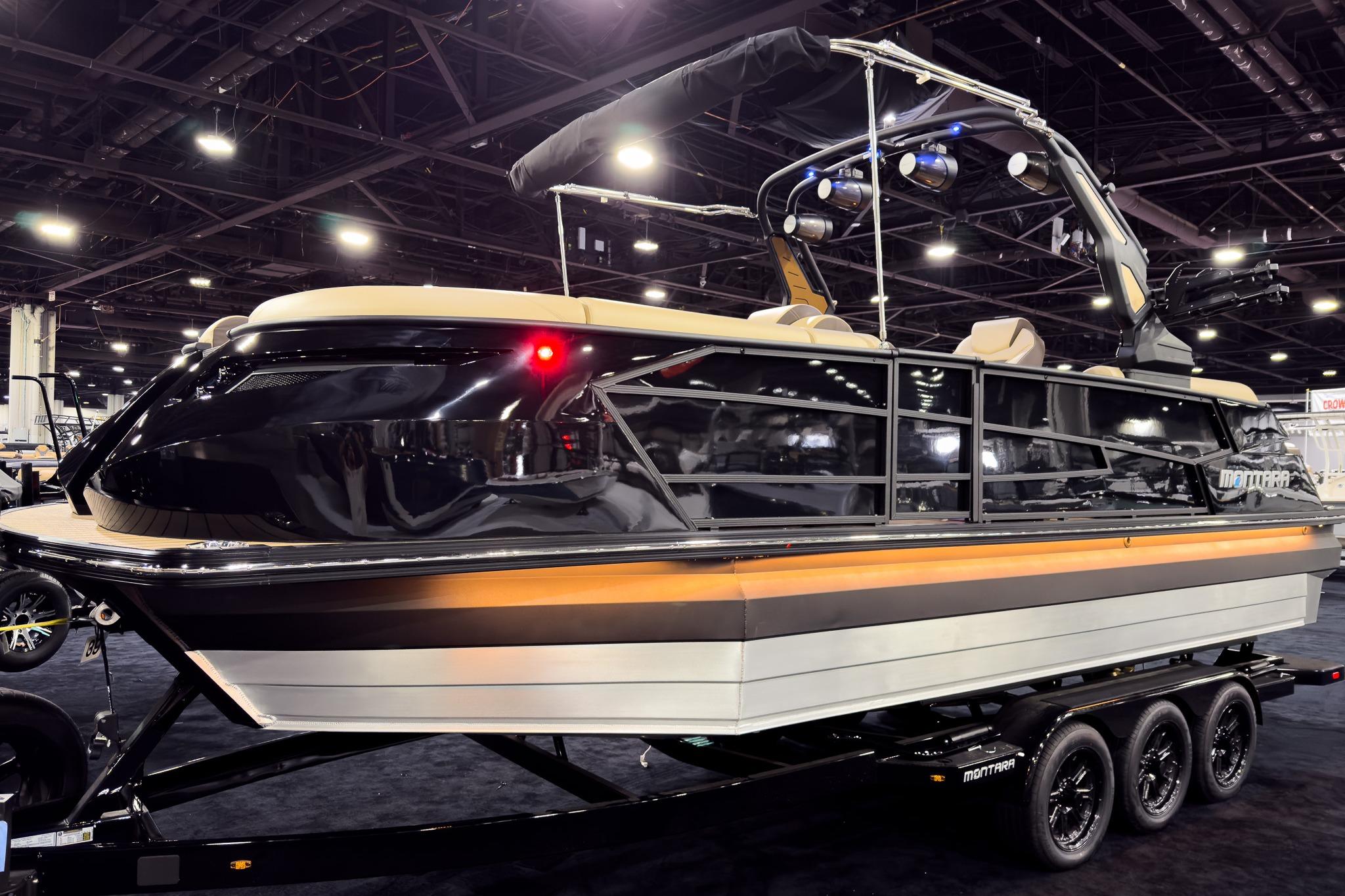 2026 Montara Surf Boss EVO SLDH 25' boat displayed indoors on a trailer.
