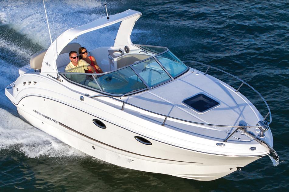 Manufacturer Provided Image: 2015 Chaparral 270 Signature boat cruising on water with two passengers.