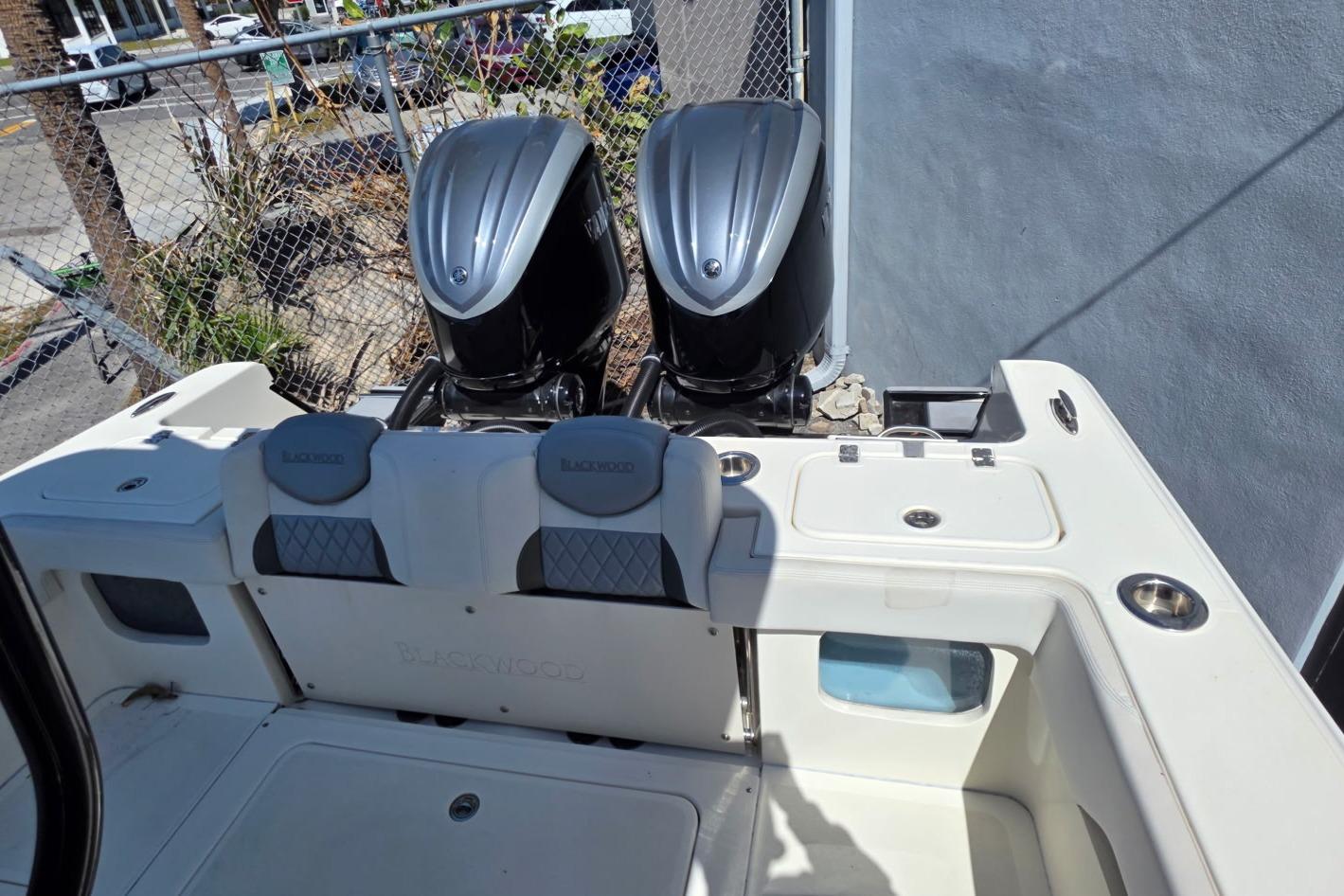 2024 Blackwood 290 boat with dual outboard engines, featuring a spacious deck layout.