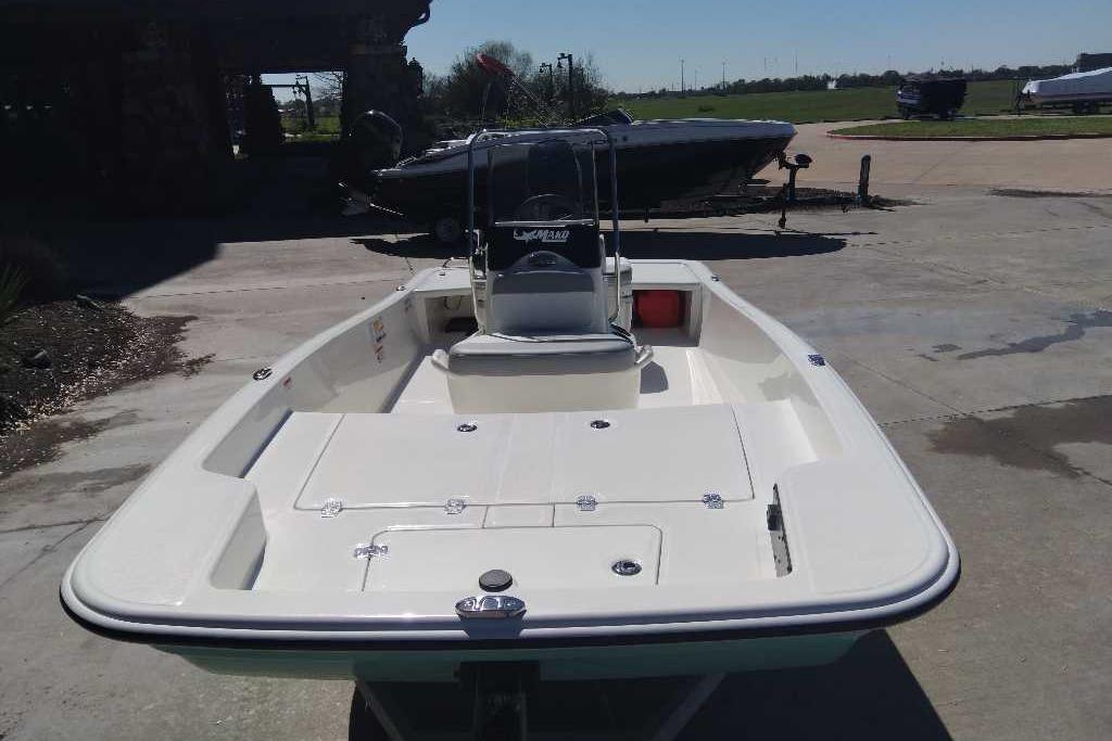 2026 Mako Pro Skiff 15 CC boat on a concrete surface, ready for water adventures.