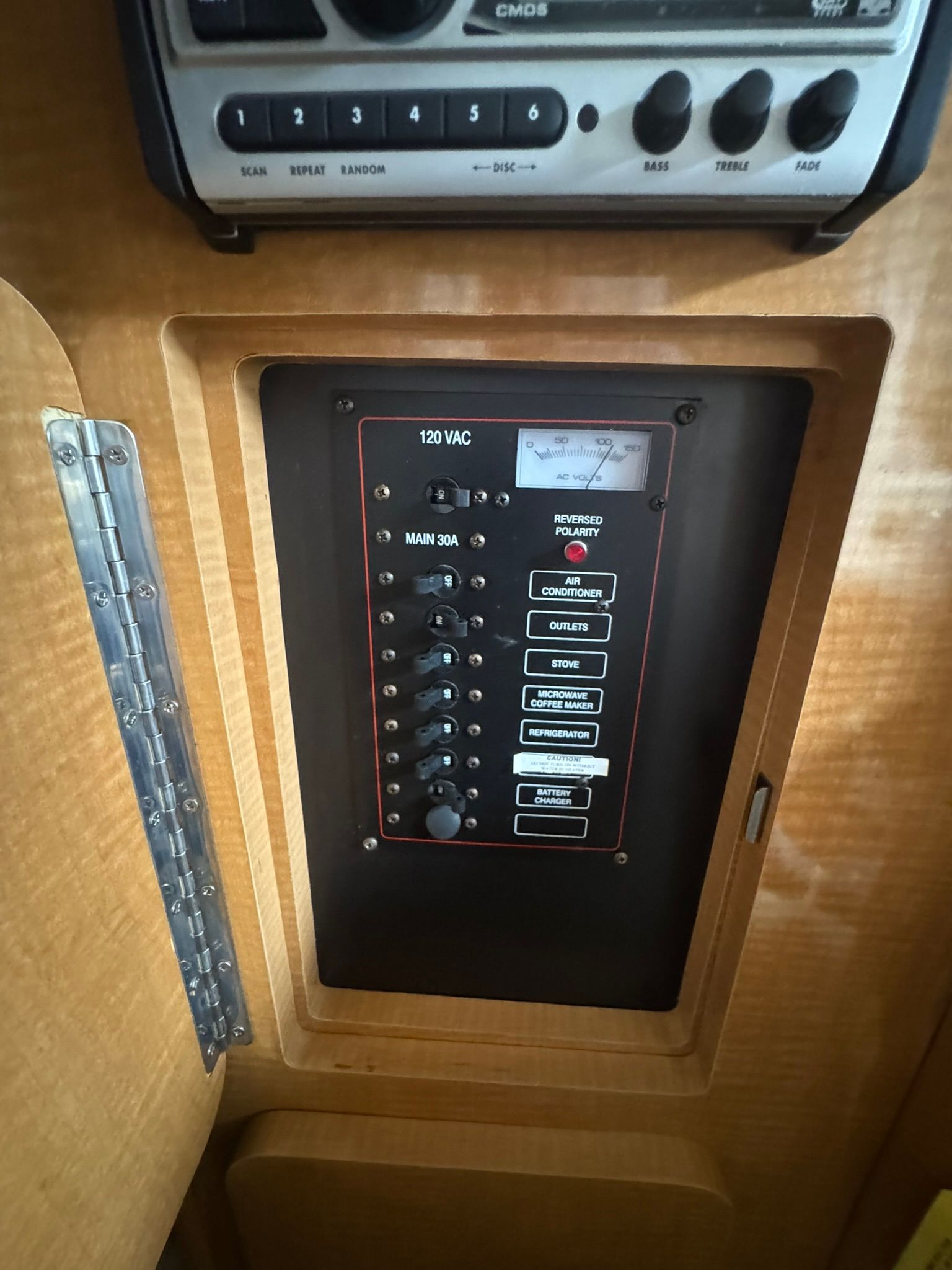 Electrical panel in a boat with switches and indicators.
