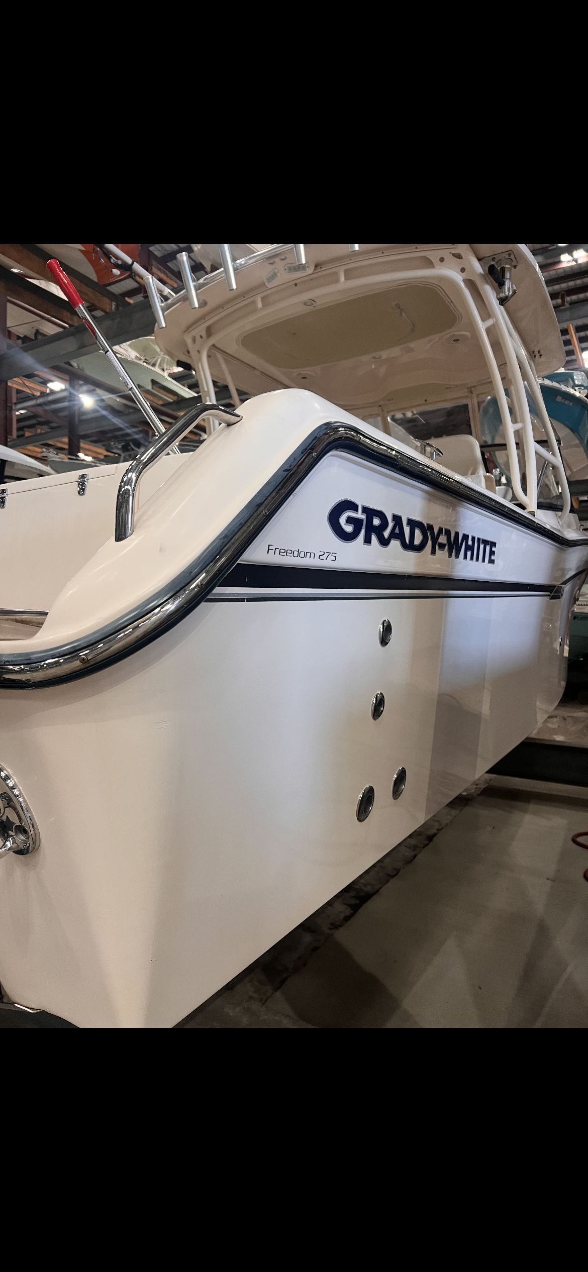 A 2015 Grady-White Freedom 275 boat in a storage facility.