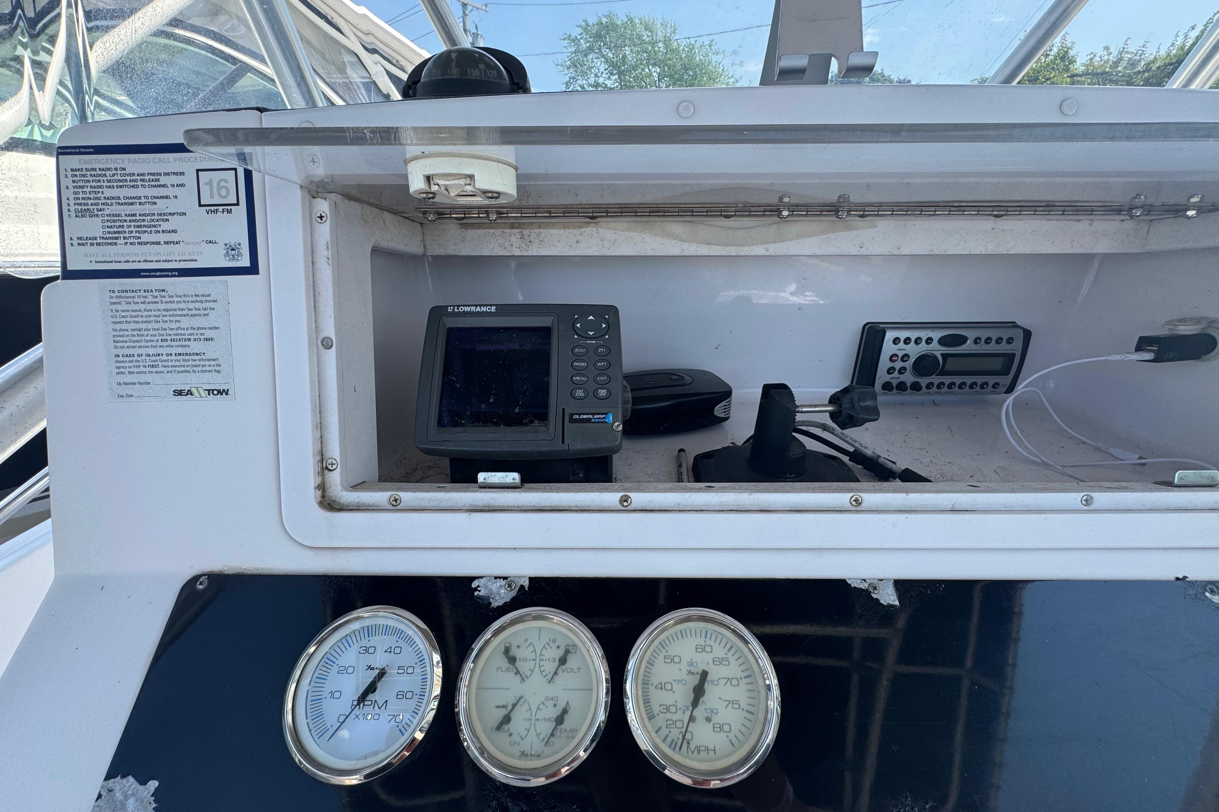 2002 Pro-Line 23 Sport boat dashboard with gauges and navigation equipment.