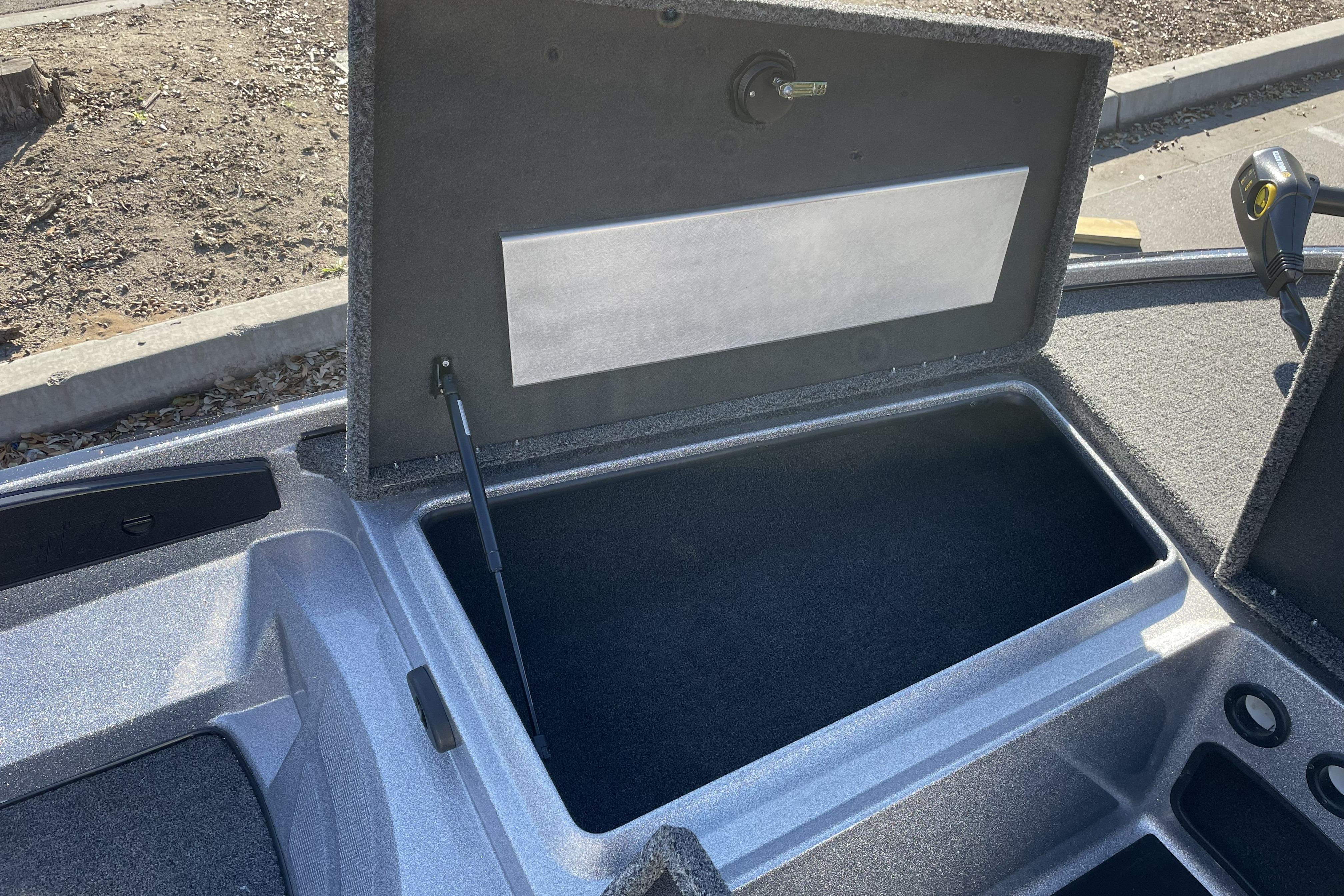 Open storage compartment in 2026 Nitro Z17 boat, showcasing interior space and design.
