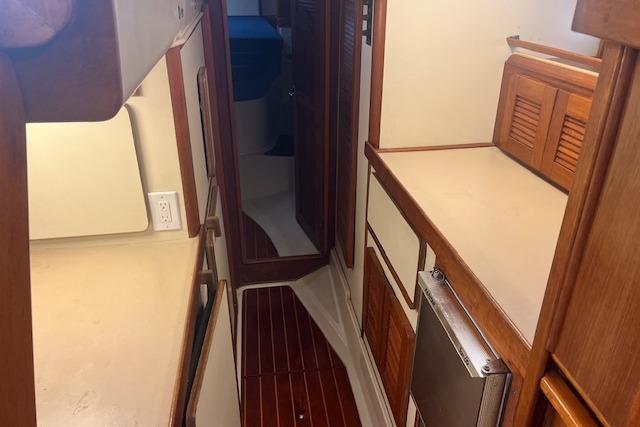 1987 Irwin 43 Mk II Cruiser interior with wood finishes and compact layout.