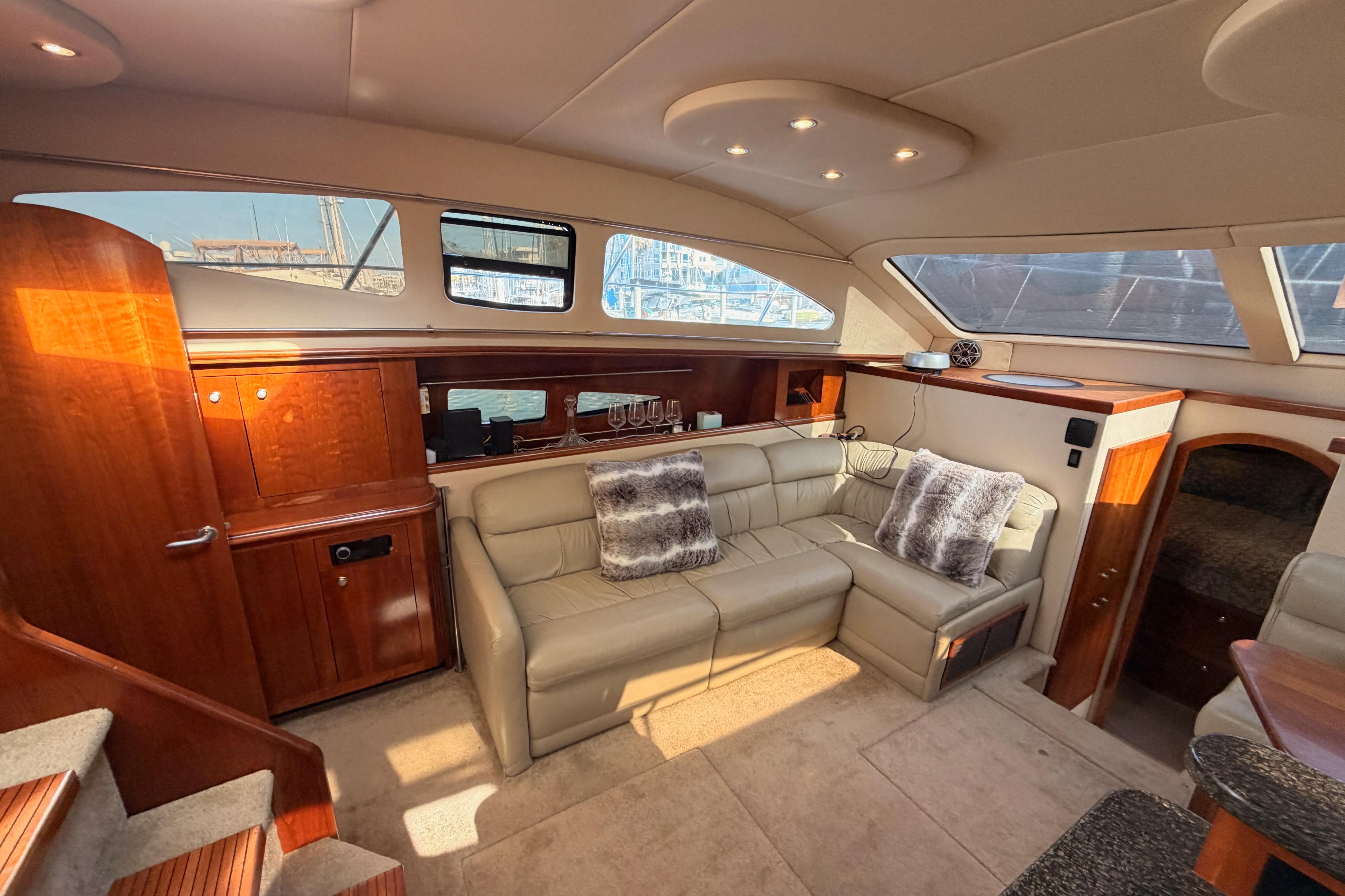 Luxurious interior of 2005 Cruisers Yachts 405 Express Motoryacht with plush seating and elegant wood finishes.