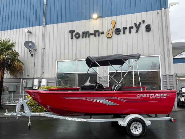 Red 2021 Crestliner 1650 Fish Hawk SC boat on trailer at Tom-n-Jerry's dealership.