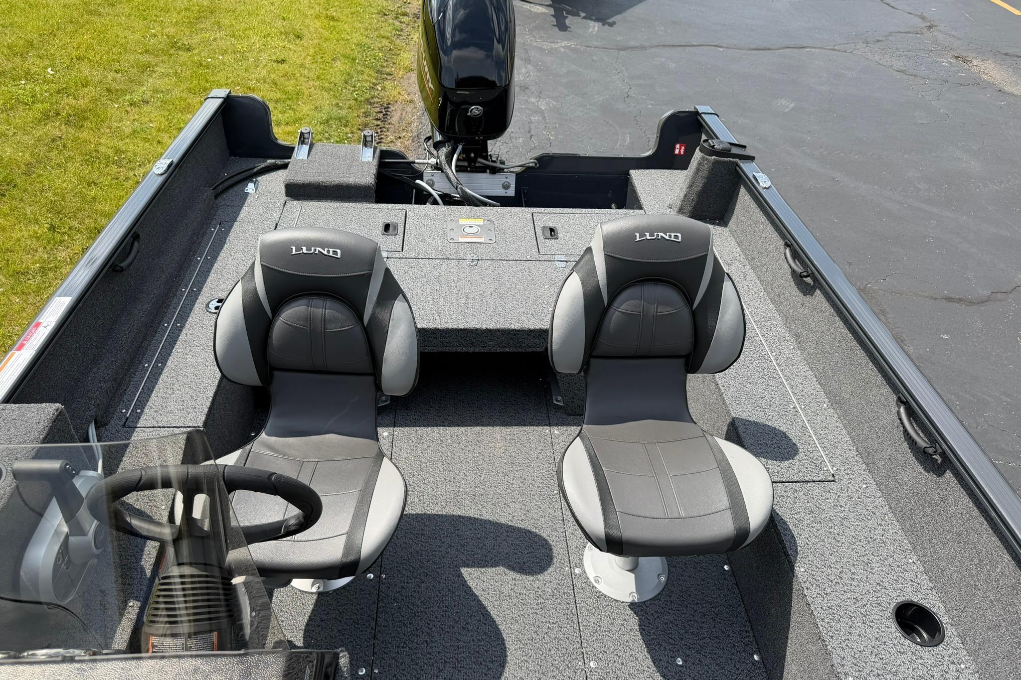 2027 Lund 1650 Rebel XL SS boat interior with two seats and steering wheel.