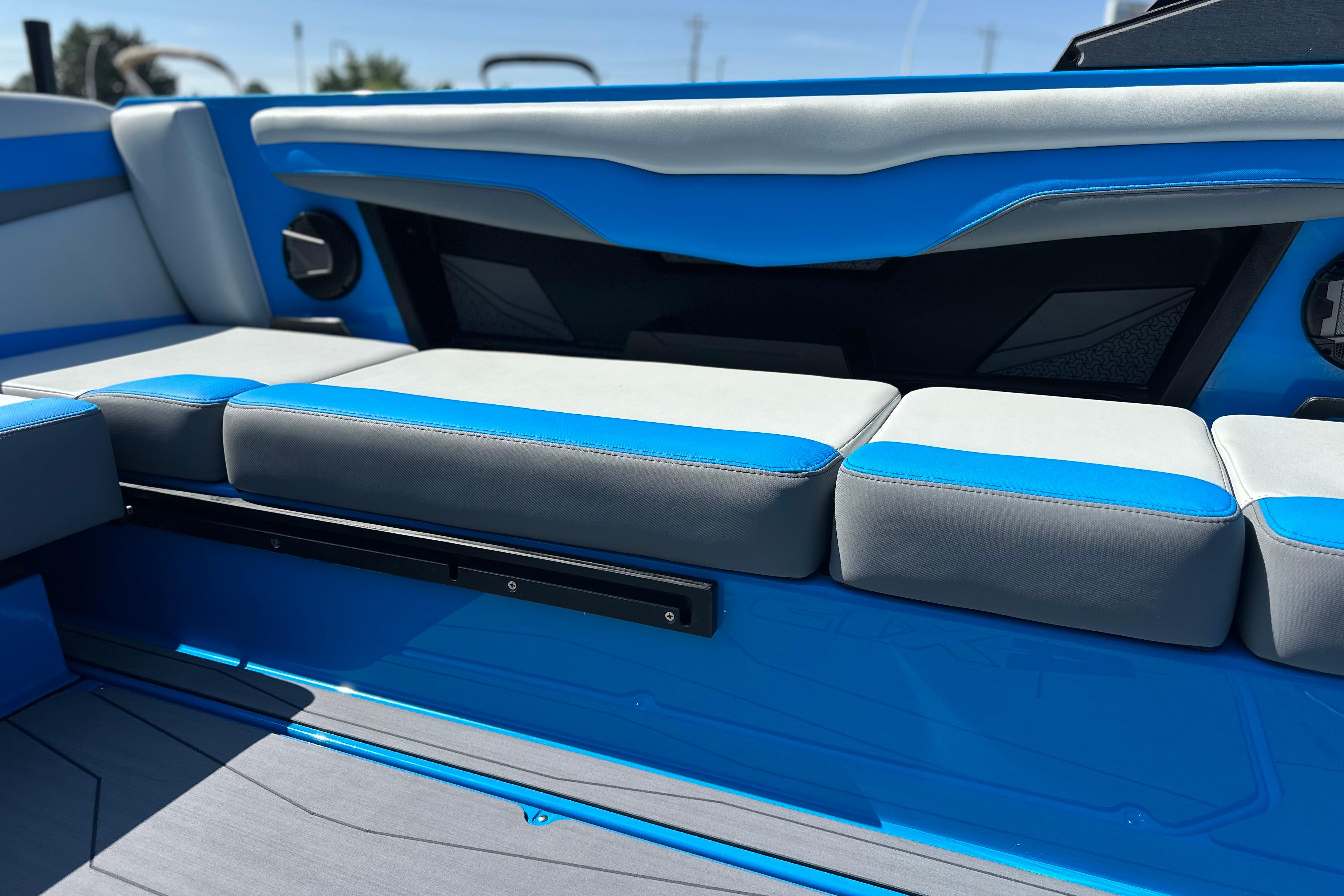 2026 Axis T235 boat interior with blue and gray seating, showcasing modern design.