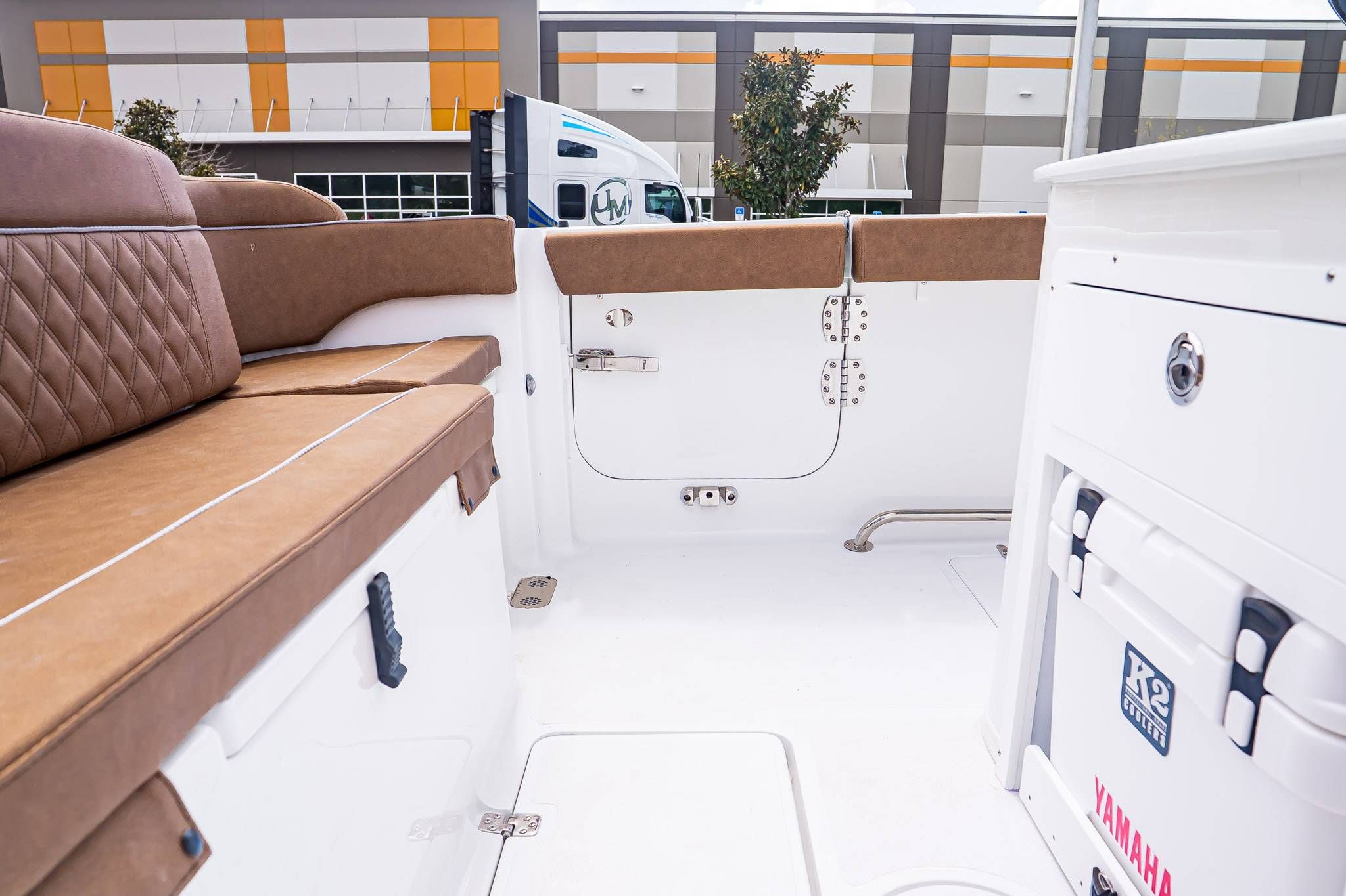 Interior of 2026 Sea Hunt ULTRA 285CB with brown upholstery.