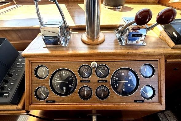 Dashboard of a 1989 Grand Banks 42 Classic boat with gauges and controls.
