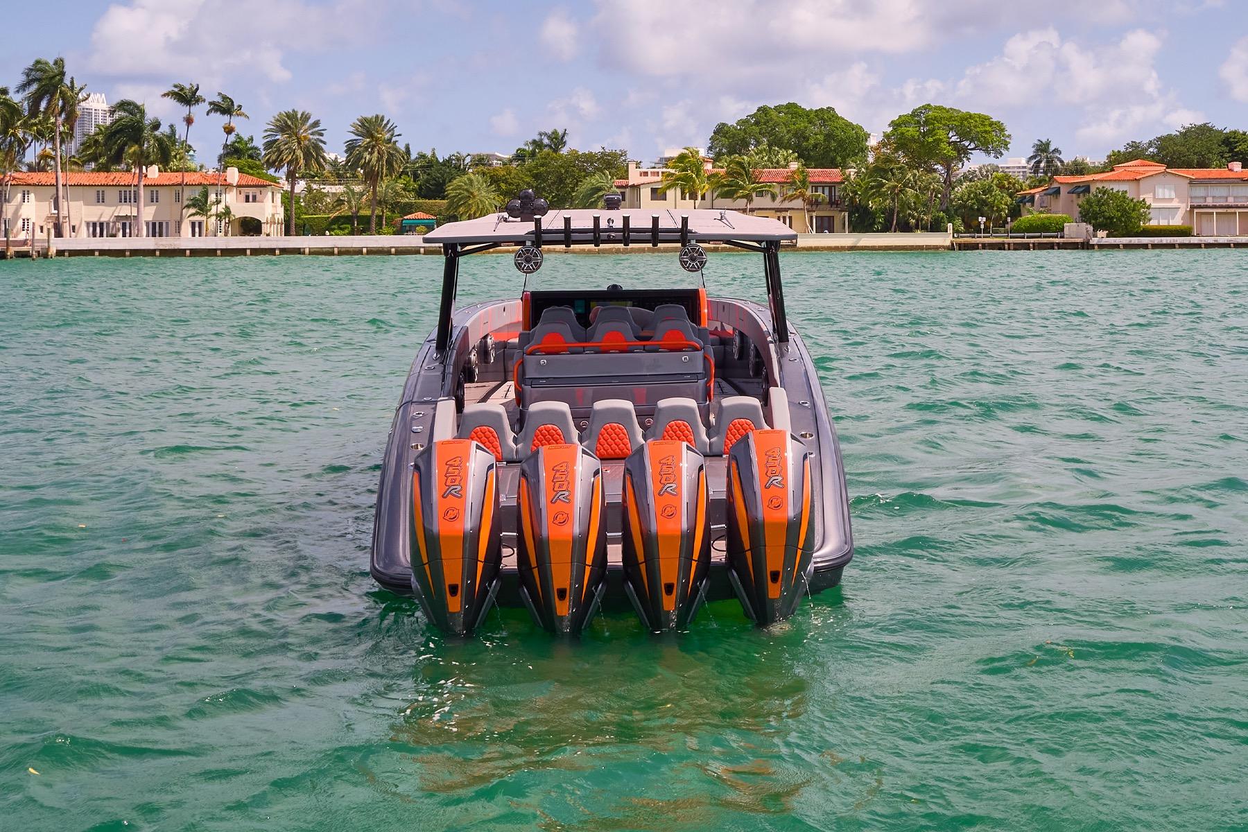 2022 Midnight Express 43 Open boat with four powerful engines on turquoise water.