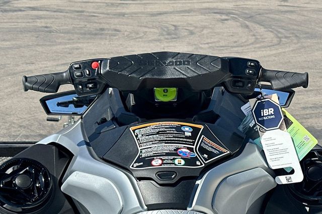 Close-up of a Sea-Doo GTX LTD 325 jet ski handlebar with informational tags.