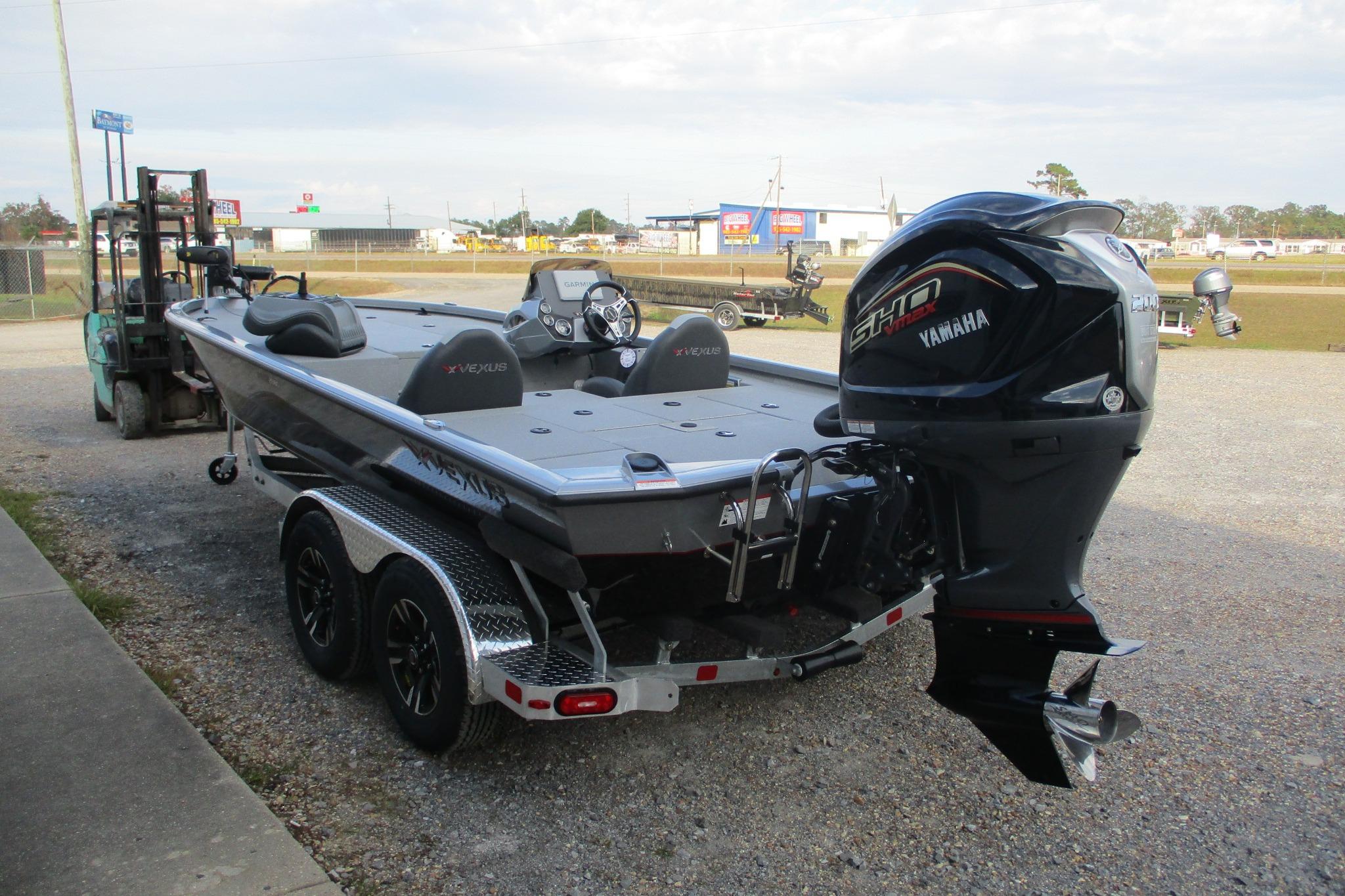 2026 Vexus AVX2080 boat with Yamaha engine on a trailer in outdoor setting.