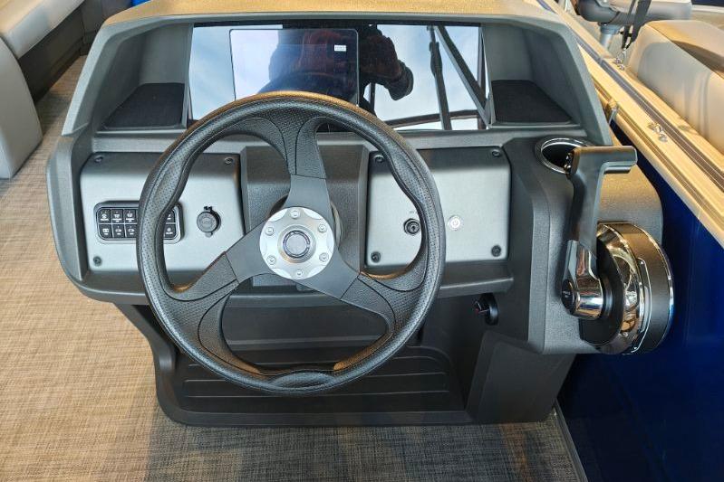 Steering console of 2026 Sun Tracker Party Barge 18 DLX pontoon boat.
