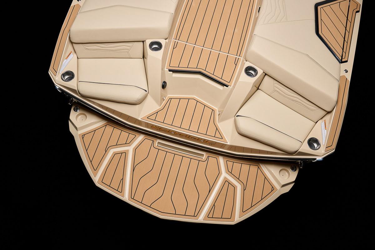 Manufacturer Provided Image: 2026 Nautique Super Air Nautique G23 boat deck with tan seating and wood accents.