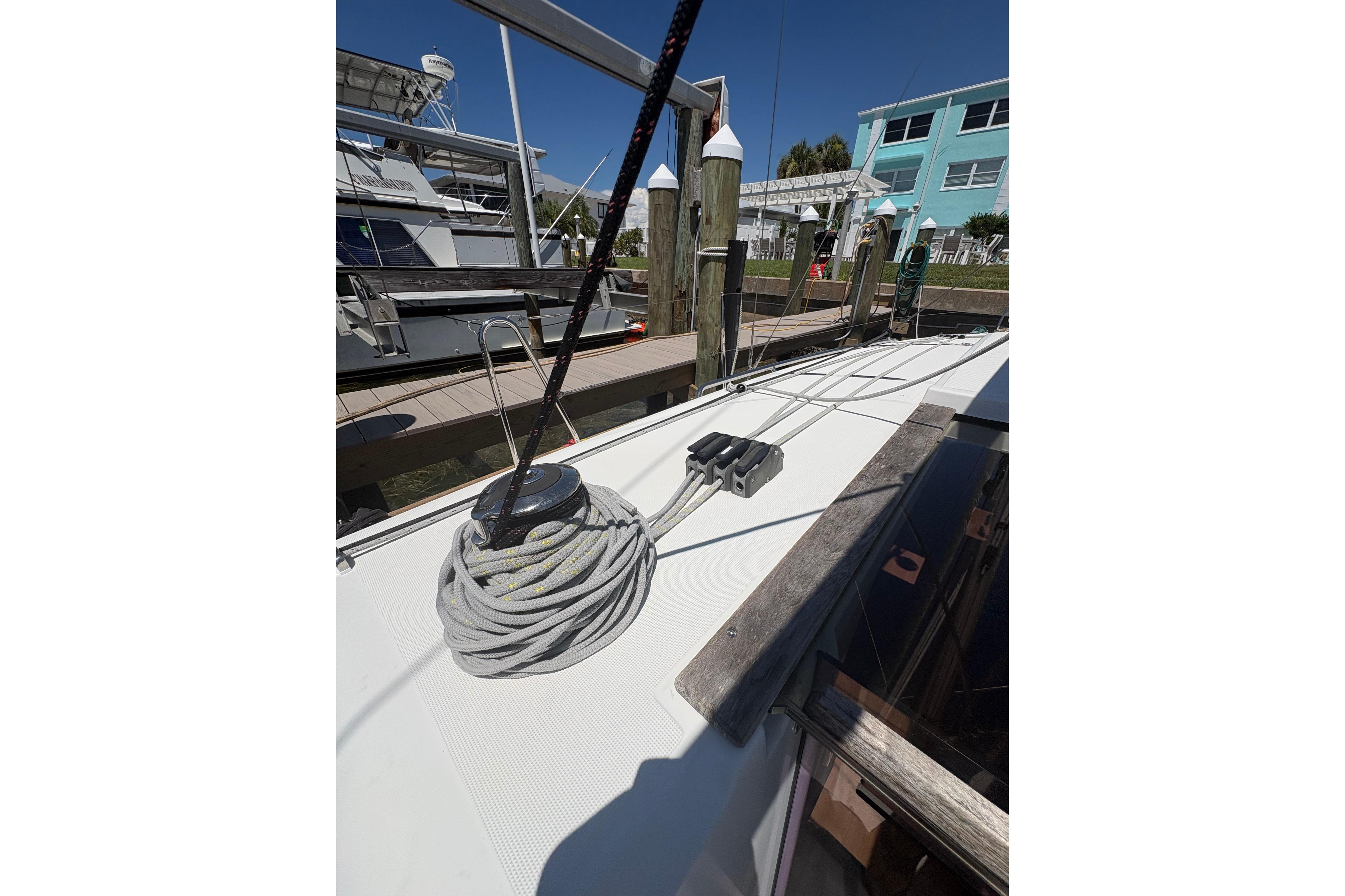 Deck view of 2021 Jeanneau Sun Odyssey 349 sailboat at marina.