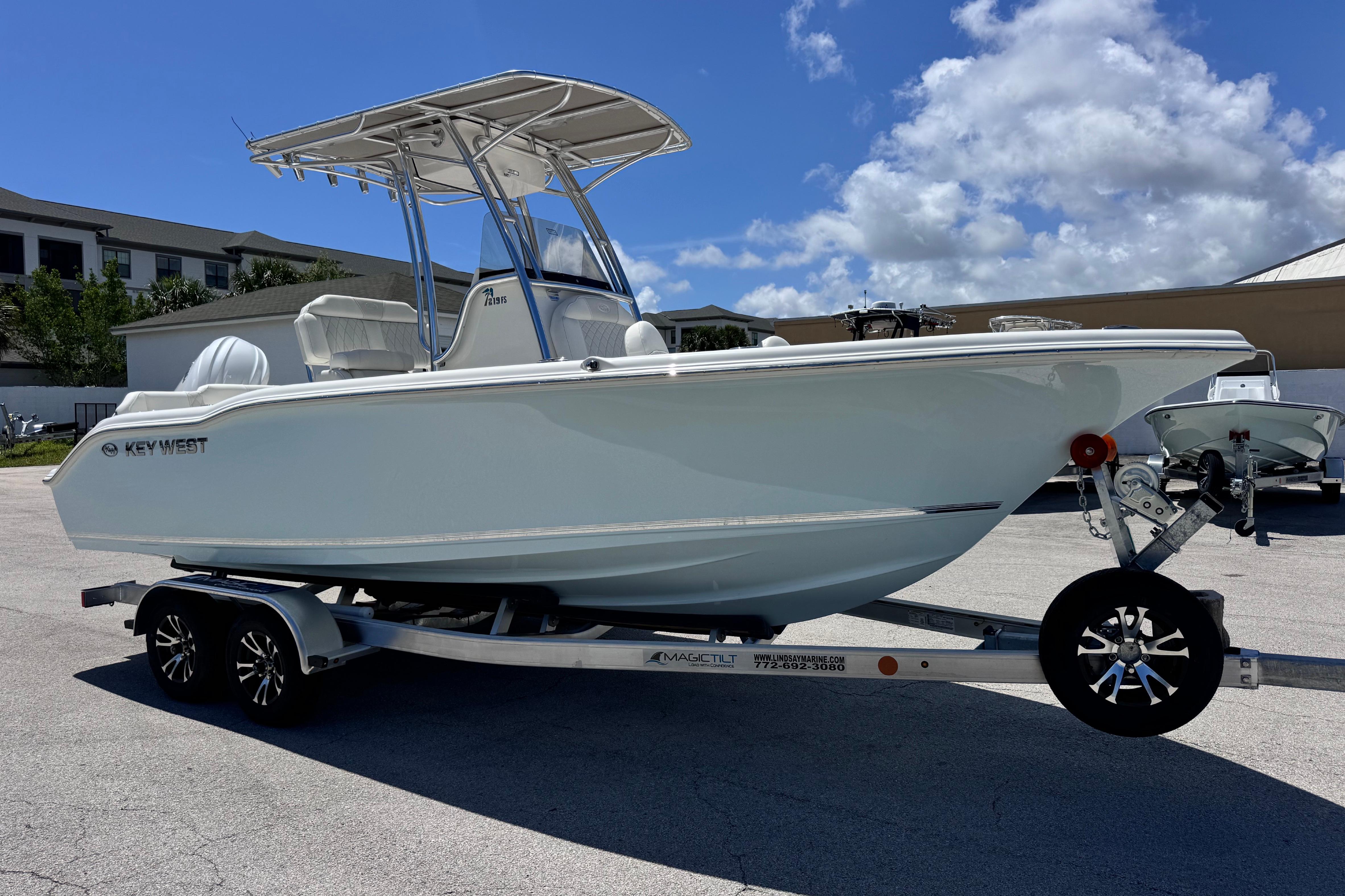 2026 Key West 219 FS boat on trailer under clear blue sky.