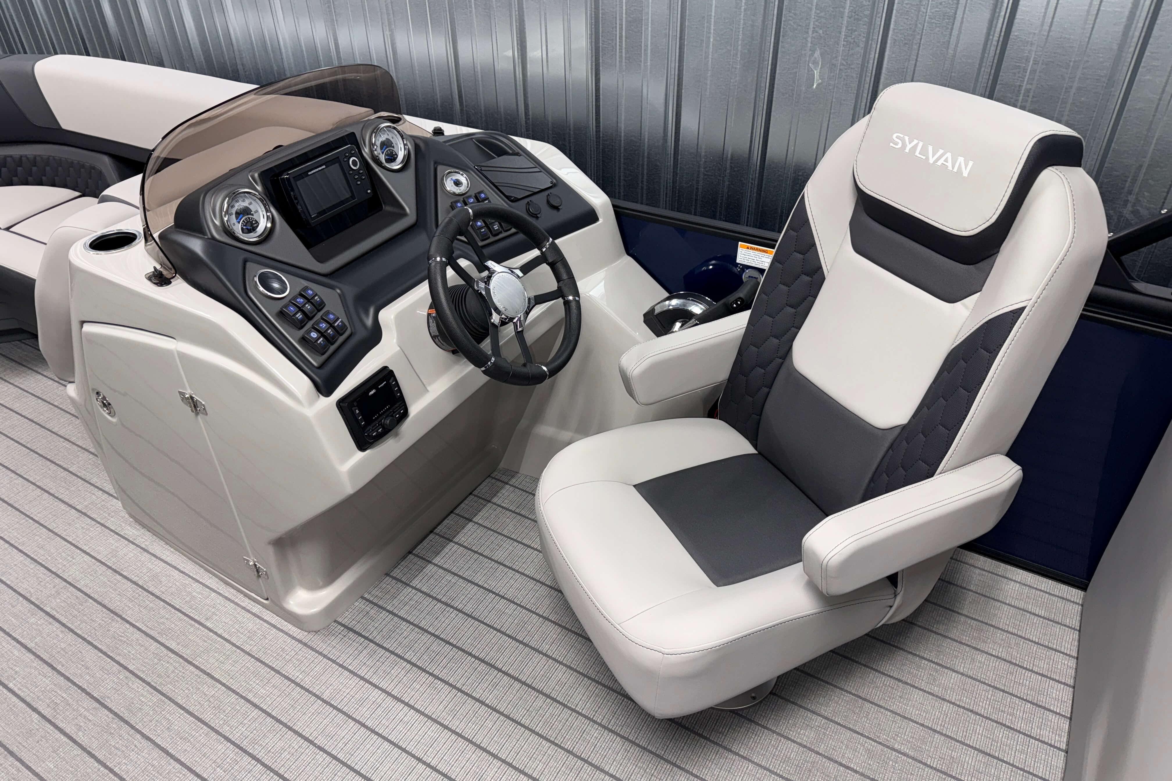 2026 Sylvan L3 SLZ boat interior with modern helm and comfortable captain's chair.