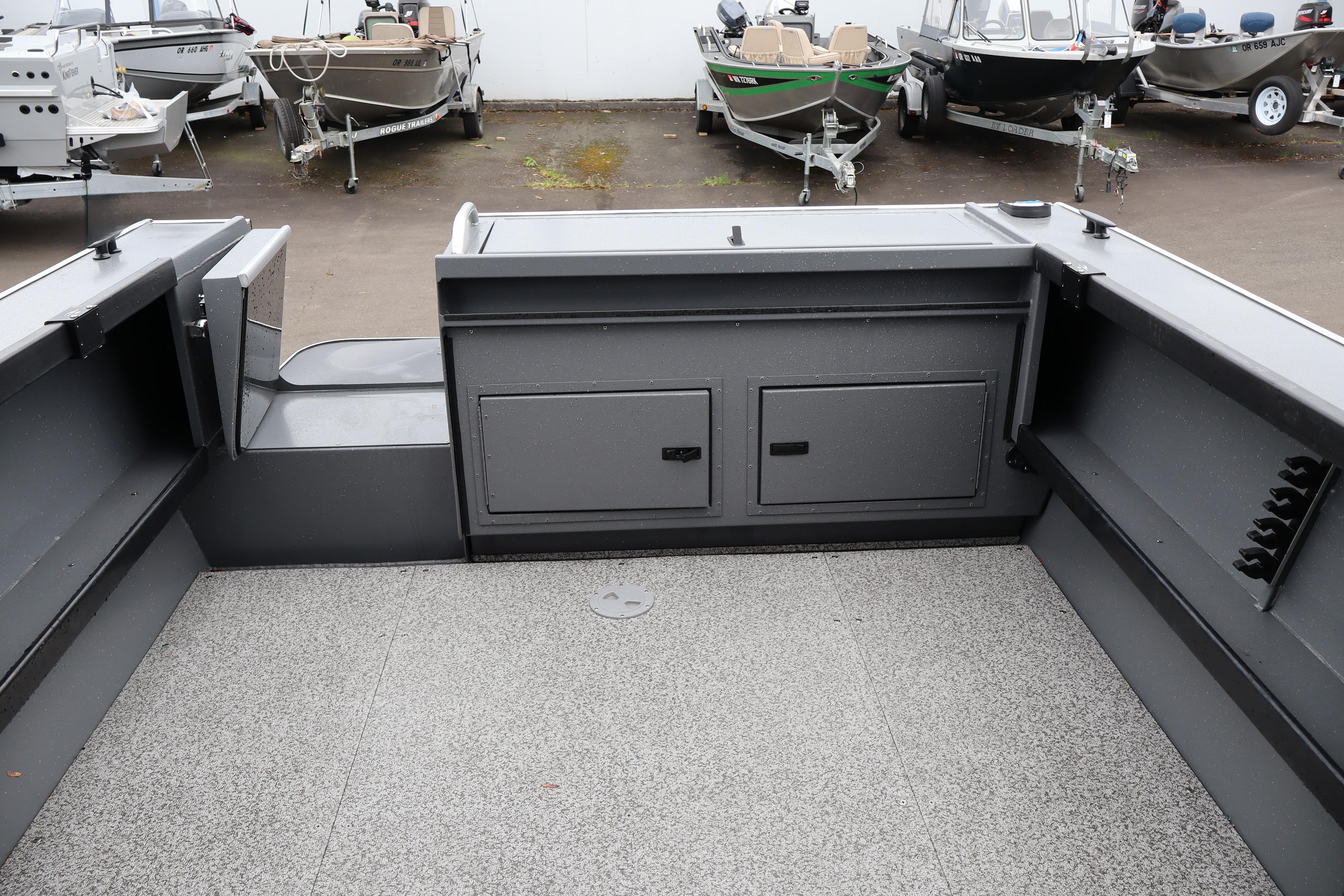 Interior view of 2026 Alumaweld Horizon 24 boat with storage compartments.