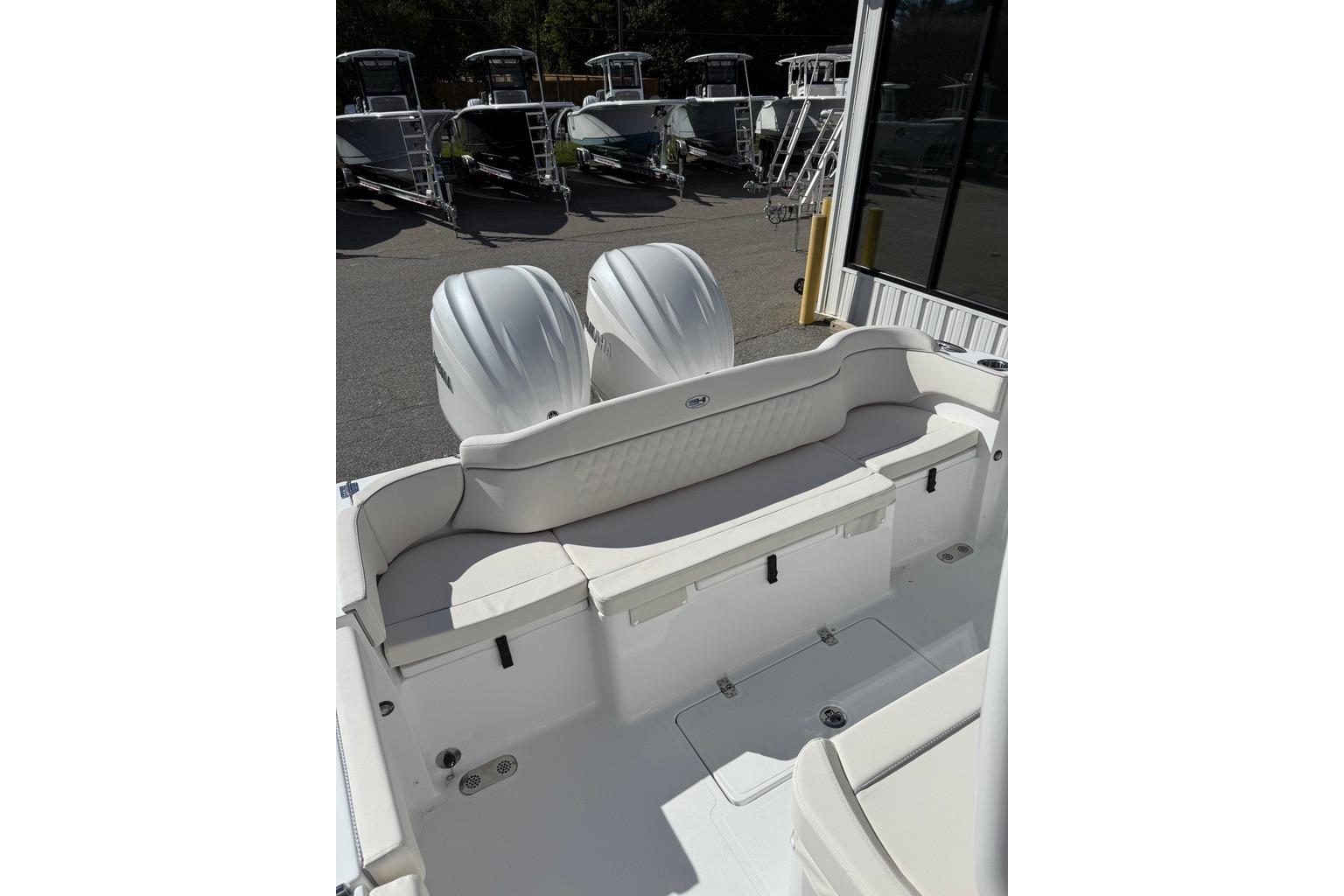2026 Sea Hunt Ultra 285 Coffin Box boat with dual engines and spacious seating.