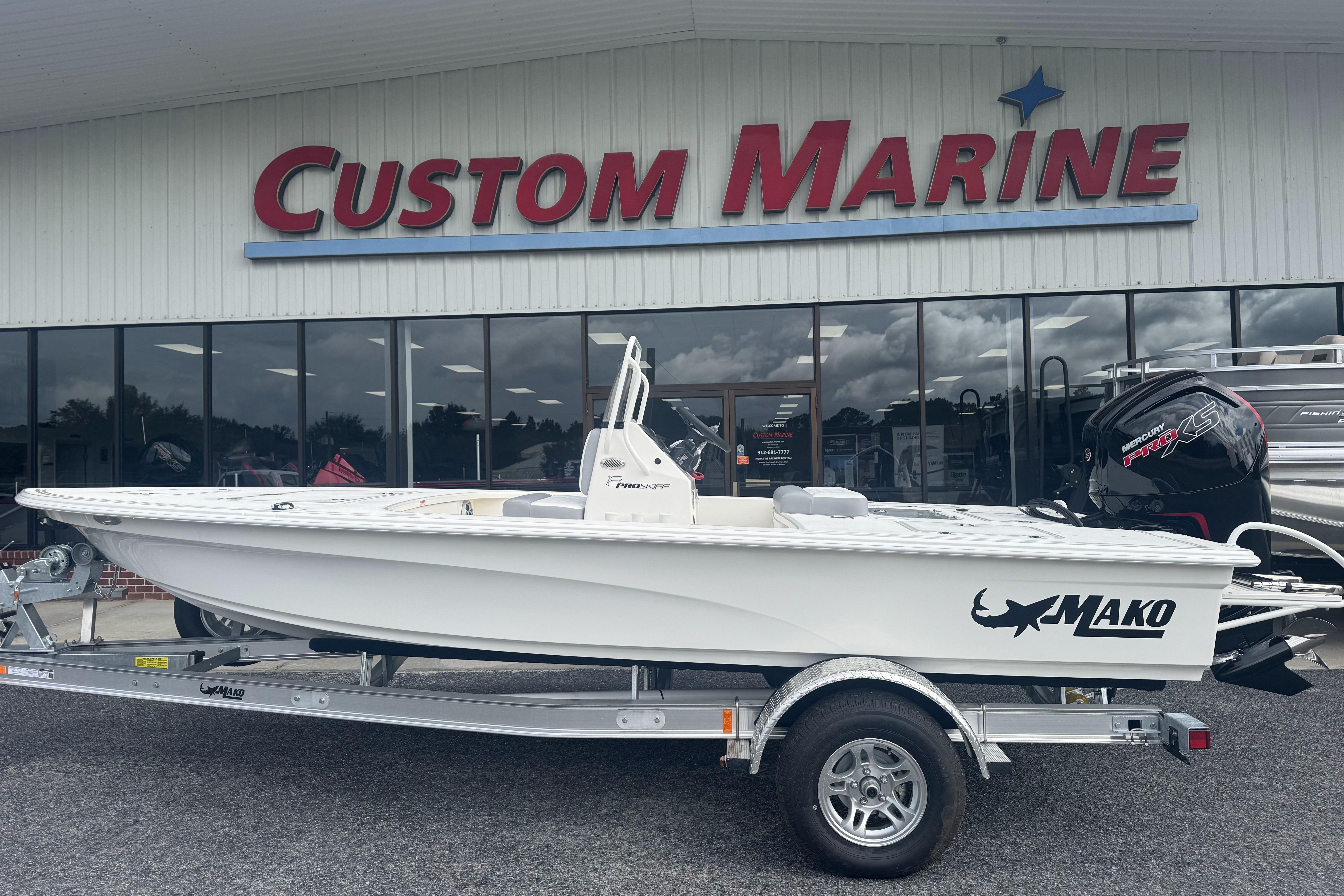 2026 Mako 18 Pro Skiff boat displayed at Custom Marine dealership.