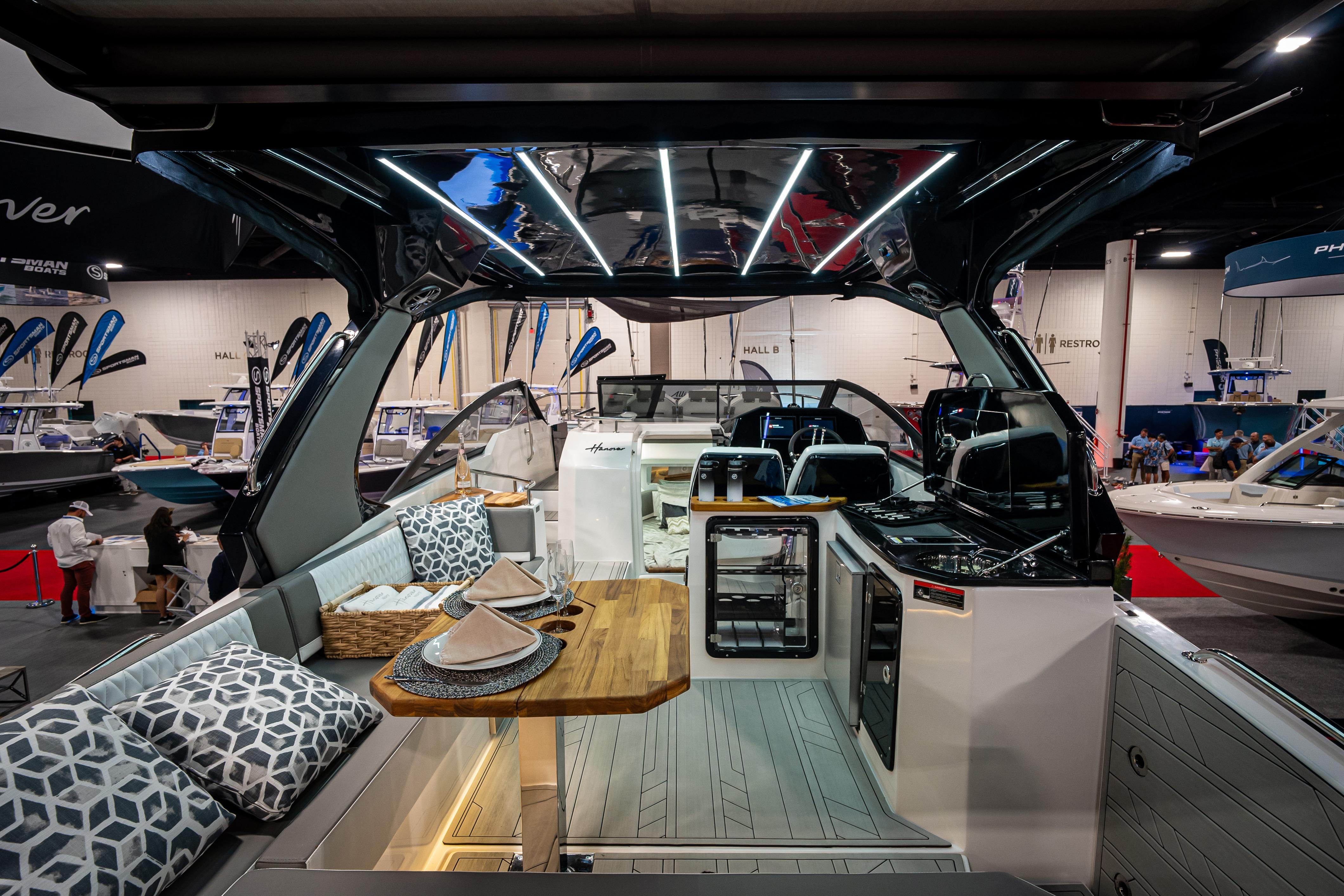 Luxurious Hanover 347 boat interior with modern design, featuring elegant seating and dining area, 2026 model.
