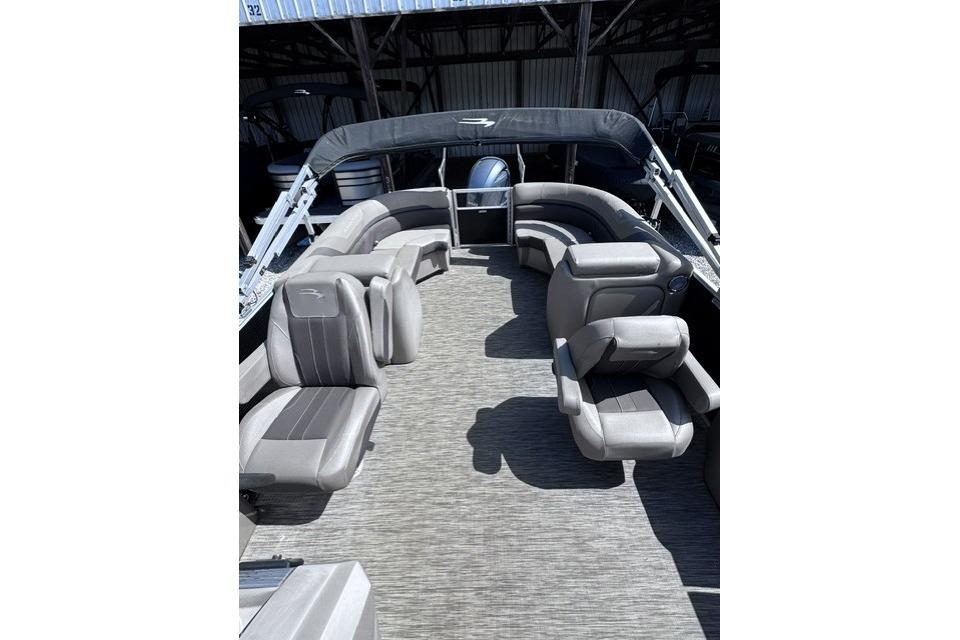 2021 Bennington 23 SSRX pontoon boat interior with gray seating and spacious layout.
