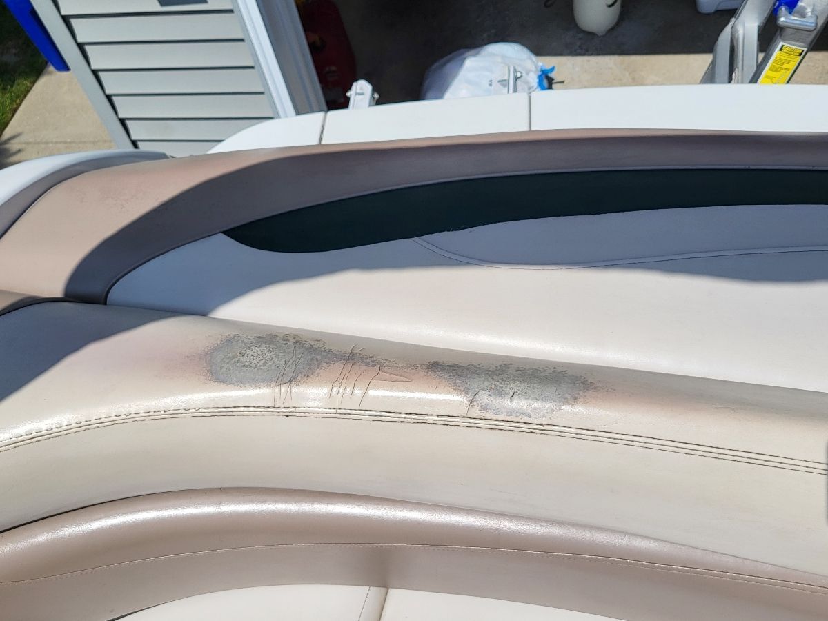Close-up of a worn seat on a boat.