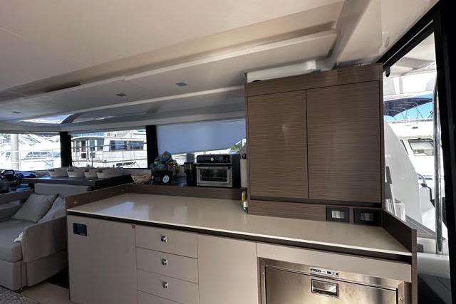 Modern kitchen interior on 2023 Leopard 46 PC yacht, featuring sleek cabinetry and appliances.