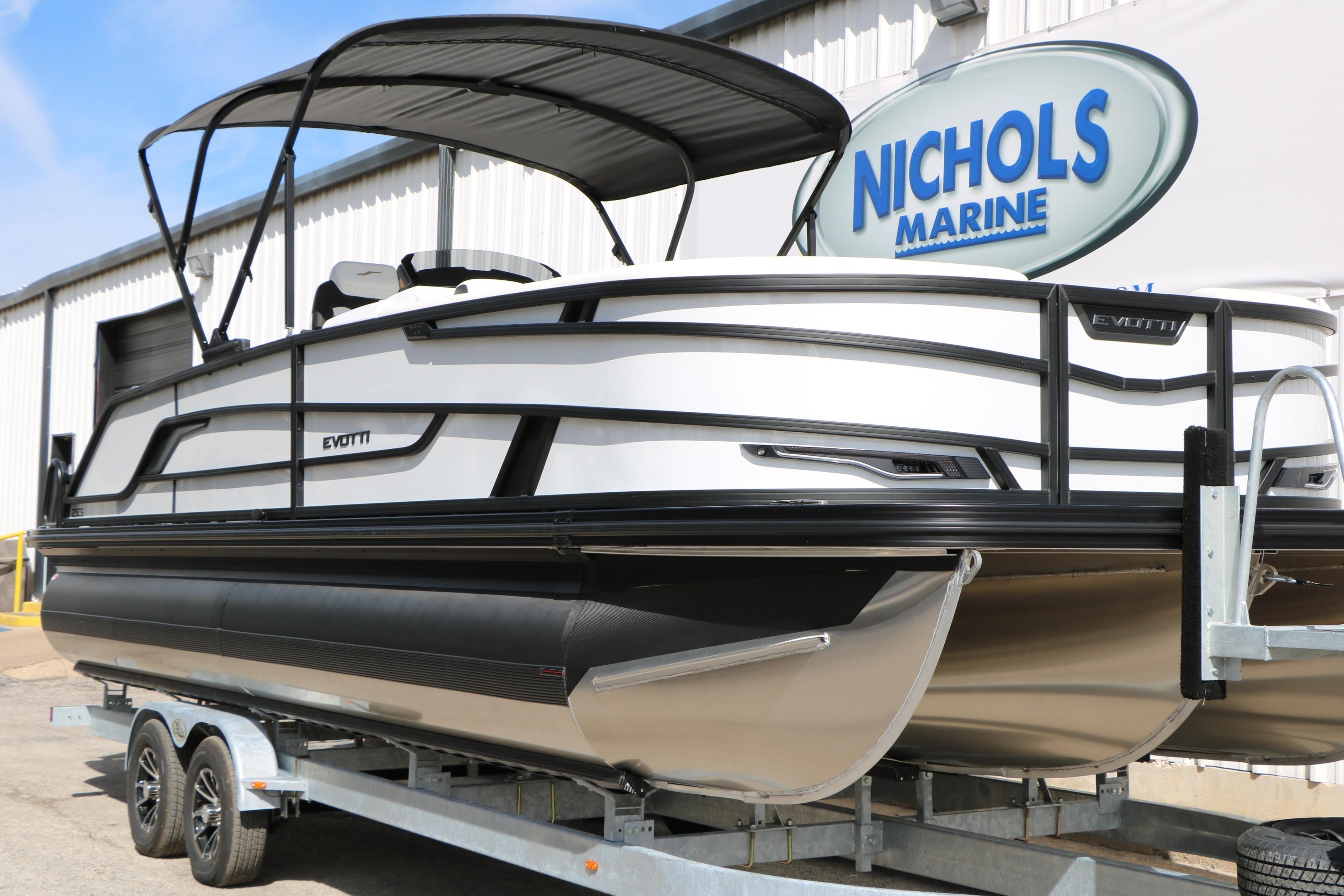 2026 Evotti 725 CS Tri-Toon boat on trailer at Nichols Marine dealership.