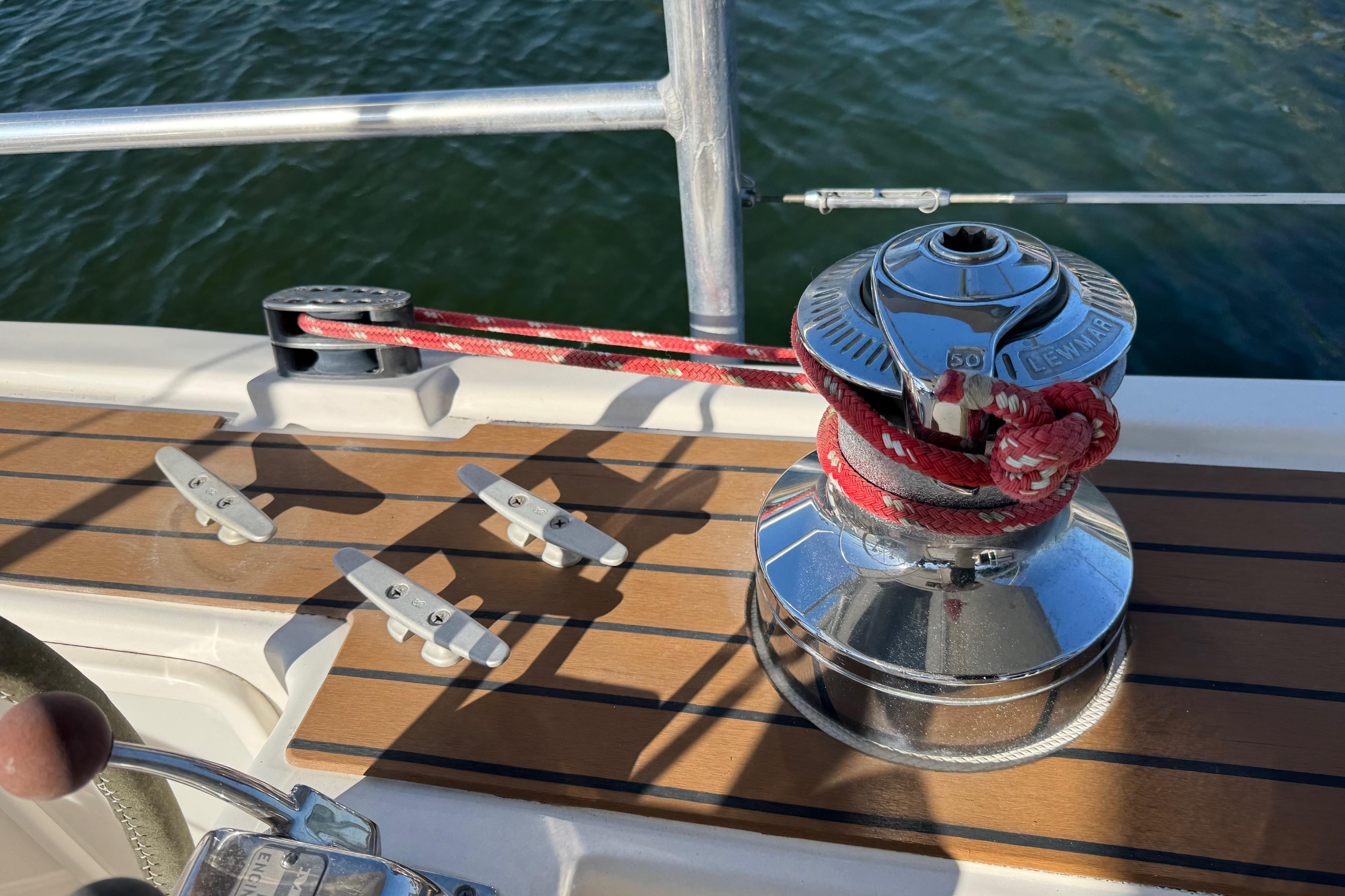 Winch and cleats on 2006 Shannon Shoalsailer sailboat deck.