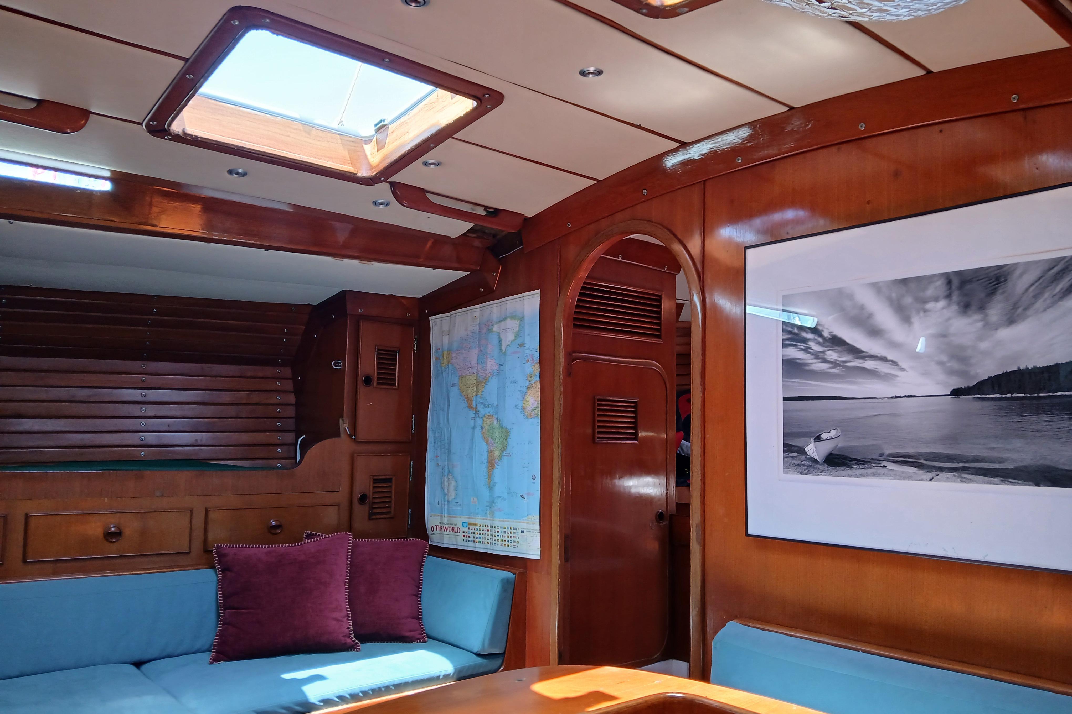 Interior of 1981 SKYE 51 yacht with wooden paneling and nautical decor.