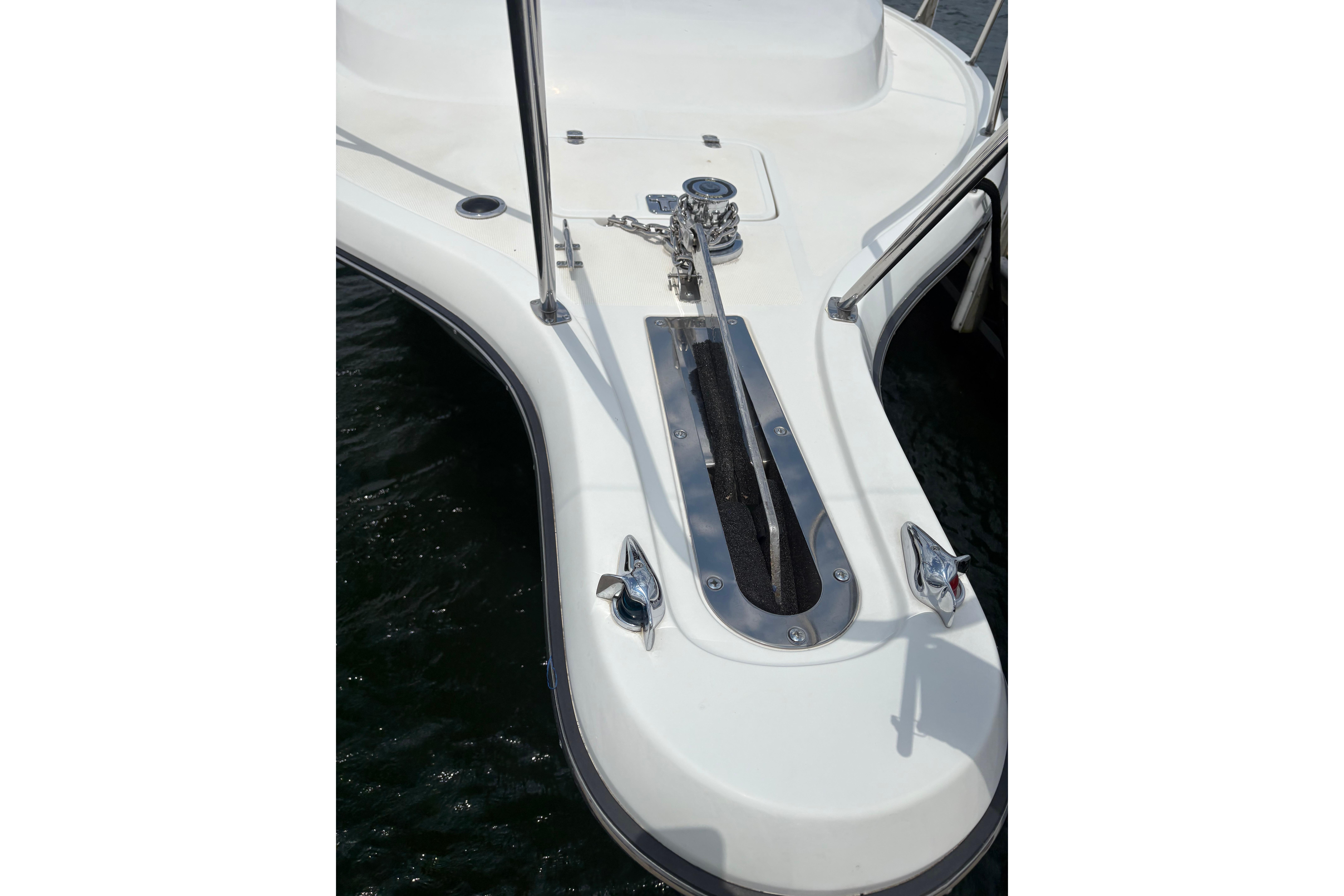 Bow of 1999 Tiara Yachts 3100 Open with anchor chain and cleats.